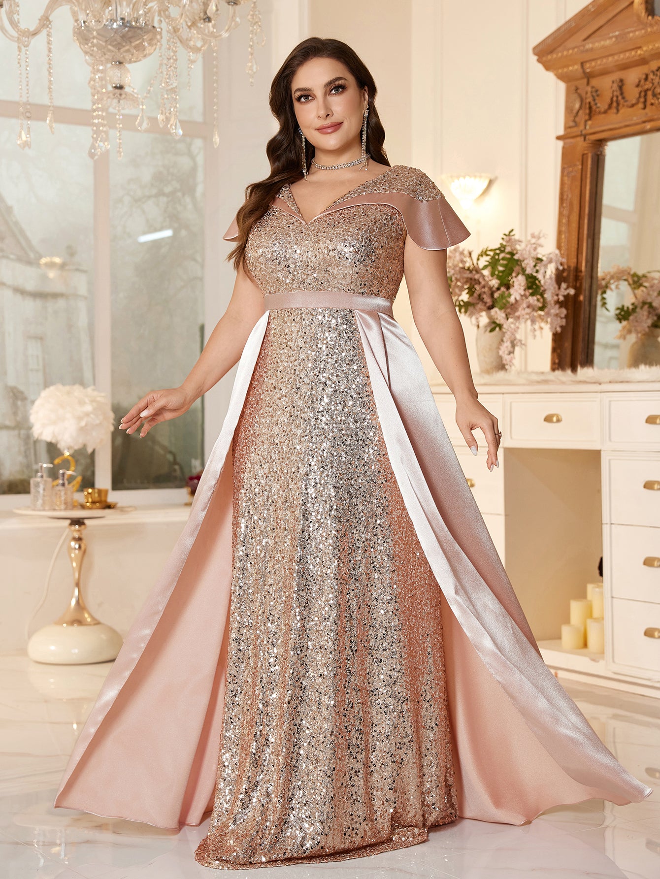 Plus-Size Floor-Fength Wedding Guest Gown With a V-Neck and Shoulder-Covering Sleeves.