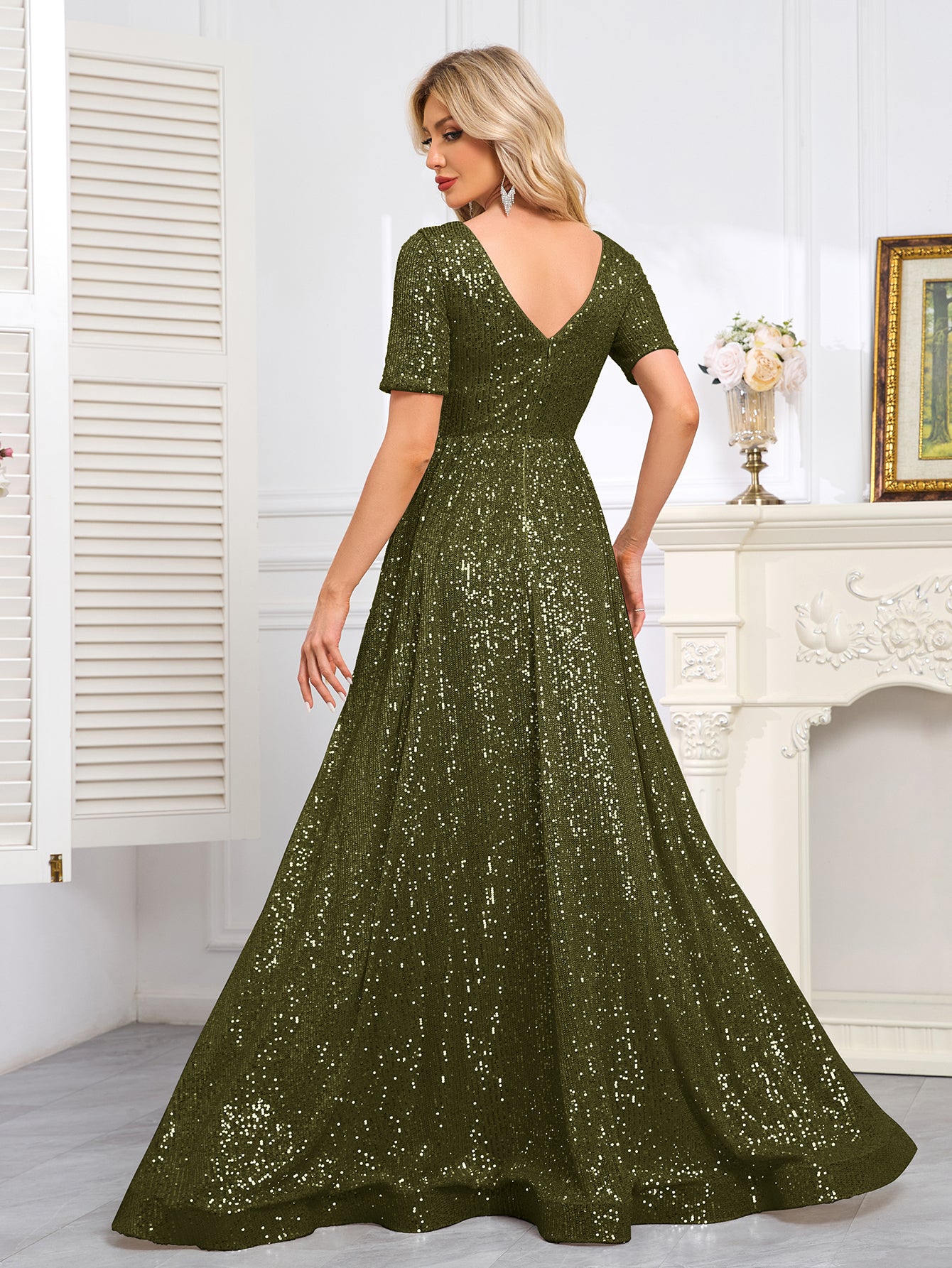 Royal Blue Sequined Short-Sleeve Gown With a Deep V-Neck and a Full, Flared Skirt.