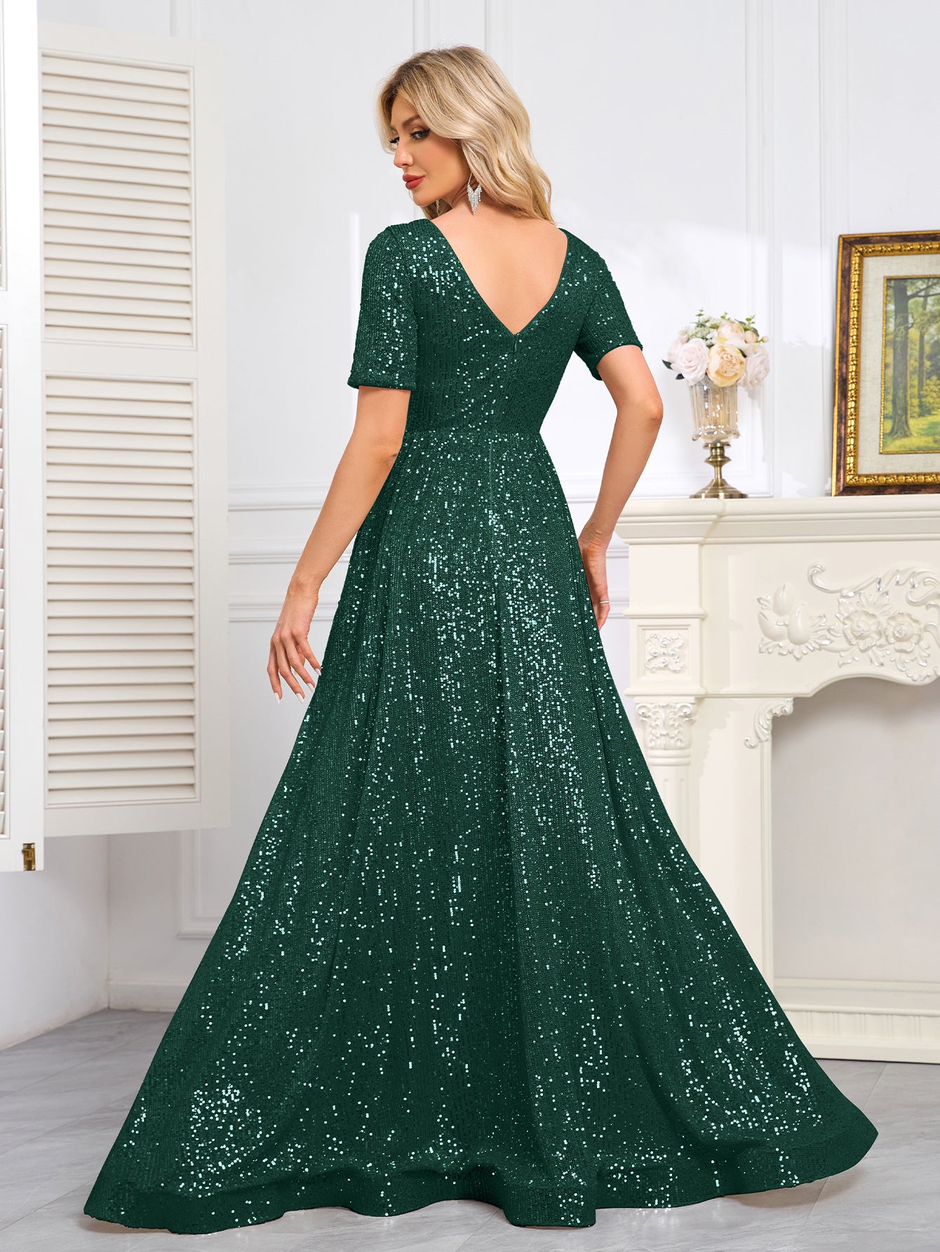 Royal Blue Sequined Short-Sleeve Gown With a Deep V-Neck and a Full, Flared Skirt.