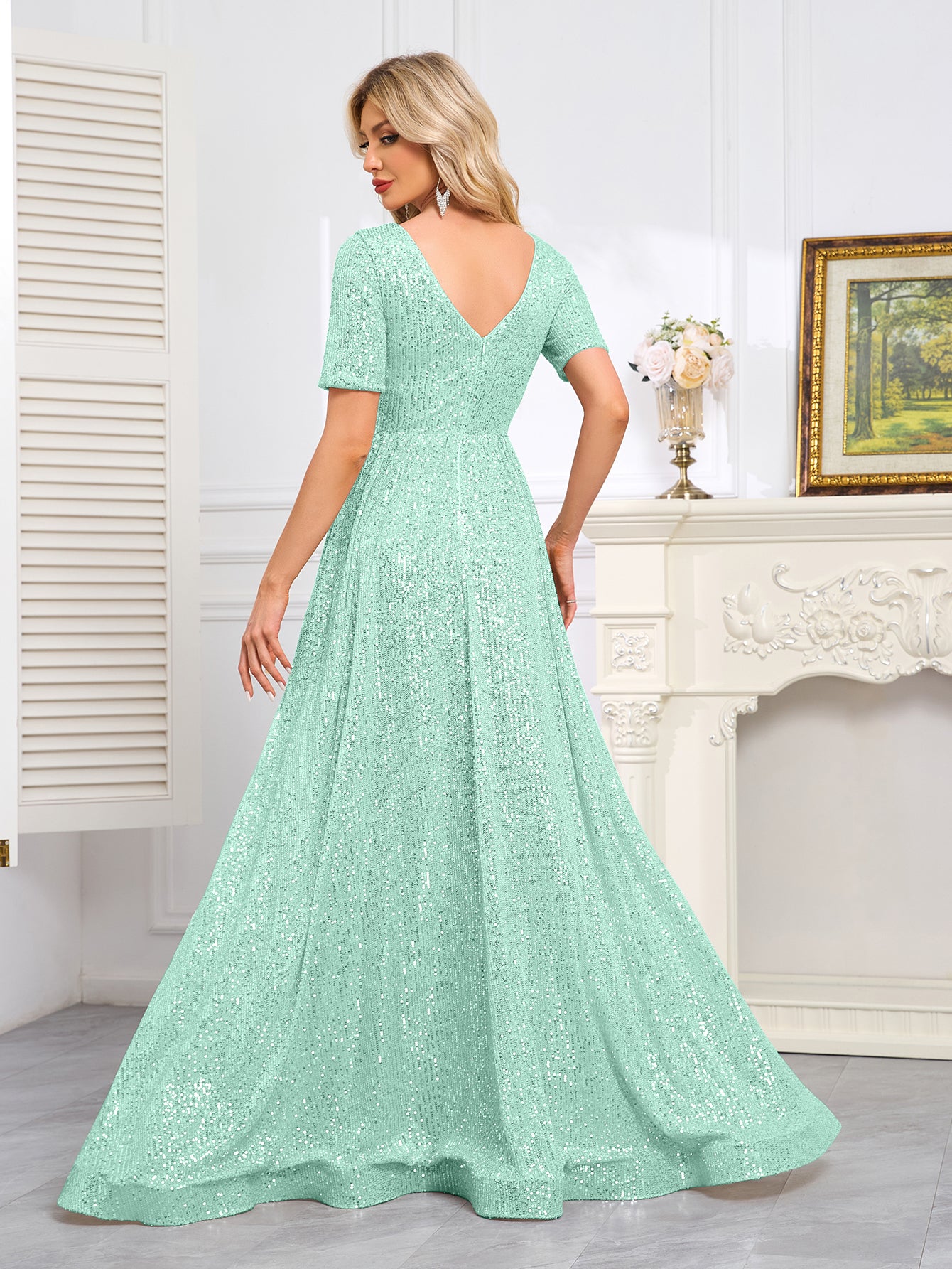 Royal Blue Sequined Short-Sleeve Gown With a Deep V-Neck and a Full, Flared Skirt.