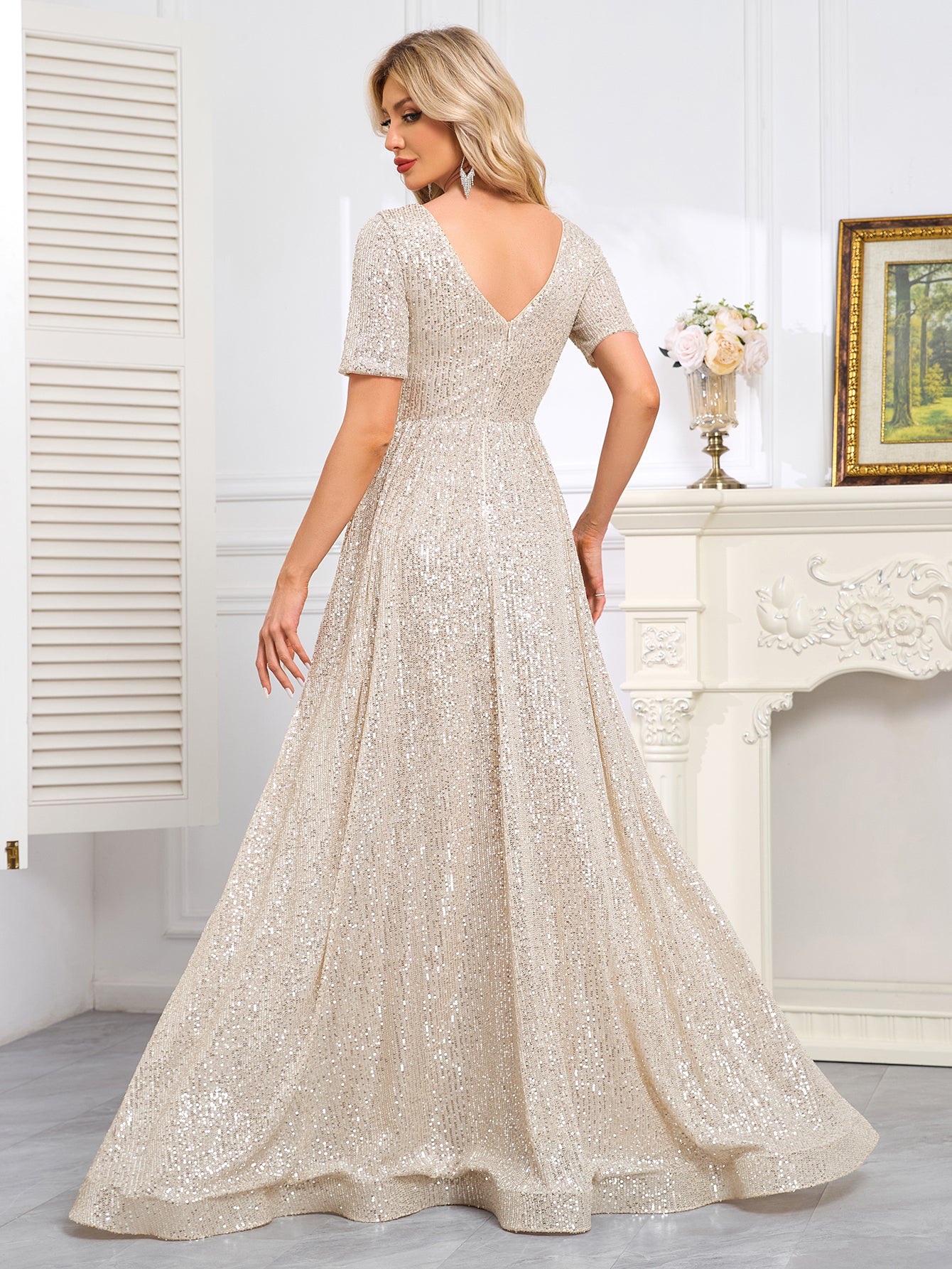 Royal Blue Sequined Short-Sleeve Gown With a Deep V-Neck and a Full, Flared Skirt.