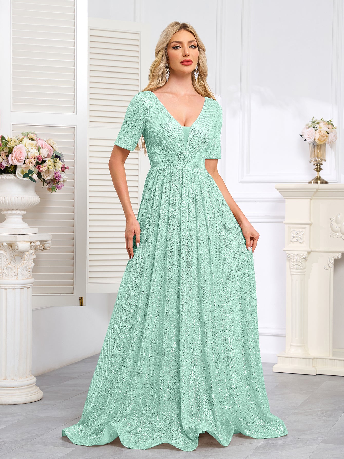 Royal Blue Sequined Short-Sleeve Gown With a Deep V-Neck and a Full, Flared Skirt.