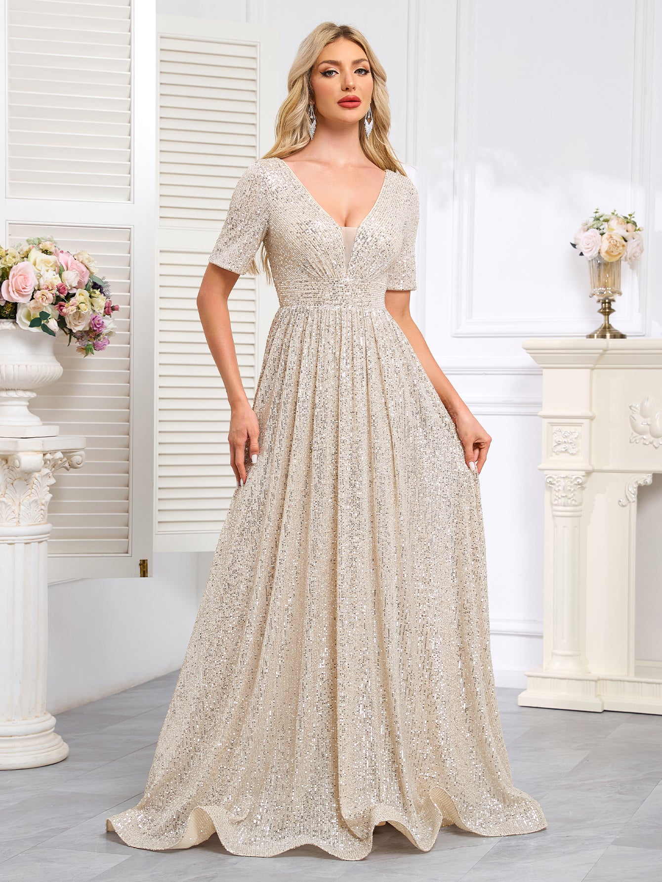 Royal Blue Sequined Short-Sleeve Gown With a Deep V-Neck and a Full, Flared Skirt.