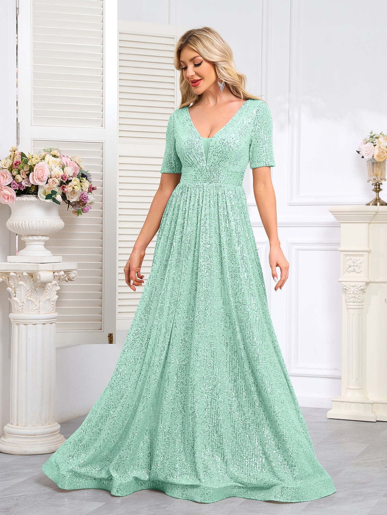 Royal Blue Sequined Short-Sleeve Gown With a Deep V-Neck and a Full, Flared Skirt.