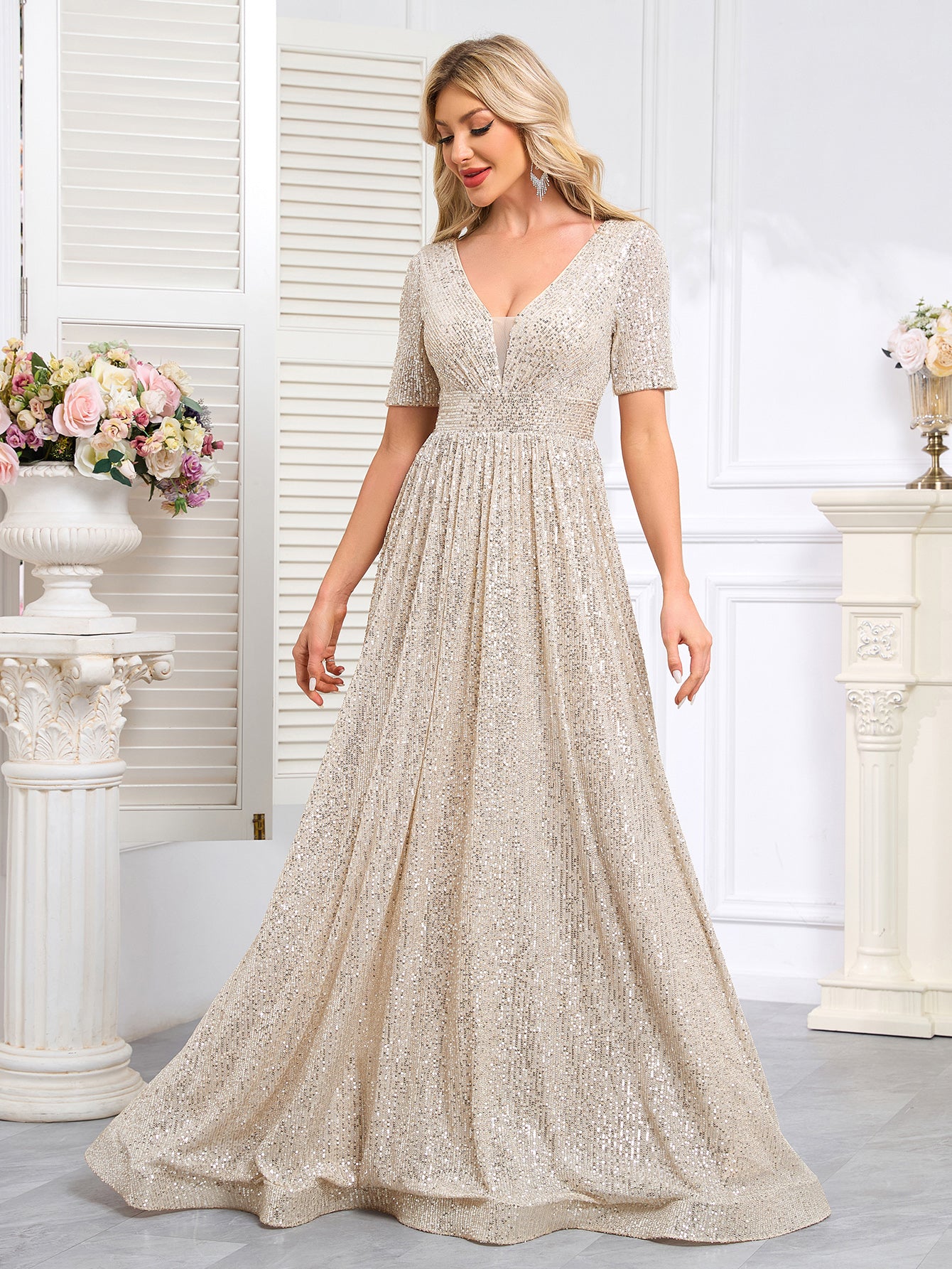 Royal Blue Sequined Short-Sleeve Gown With a Deep V-Neck and a Full, Flared Skirt.