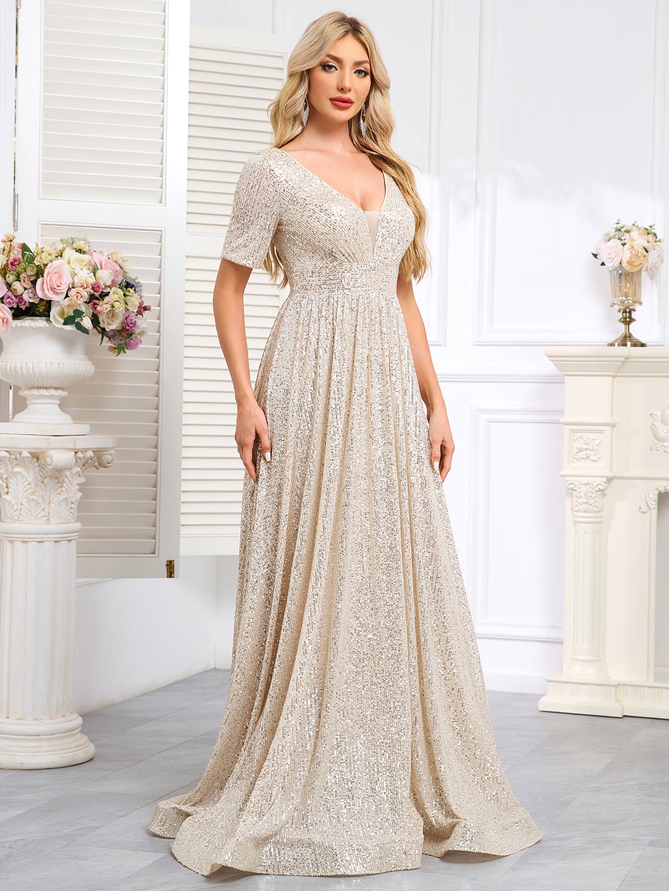 Royal Blue Sequined Short-Sleeve Gown With a Deep V-Neck and a Full, Flared Skirt.