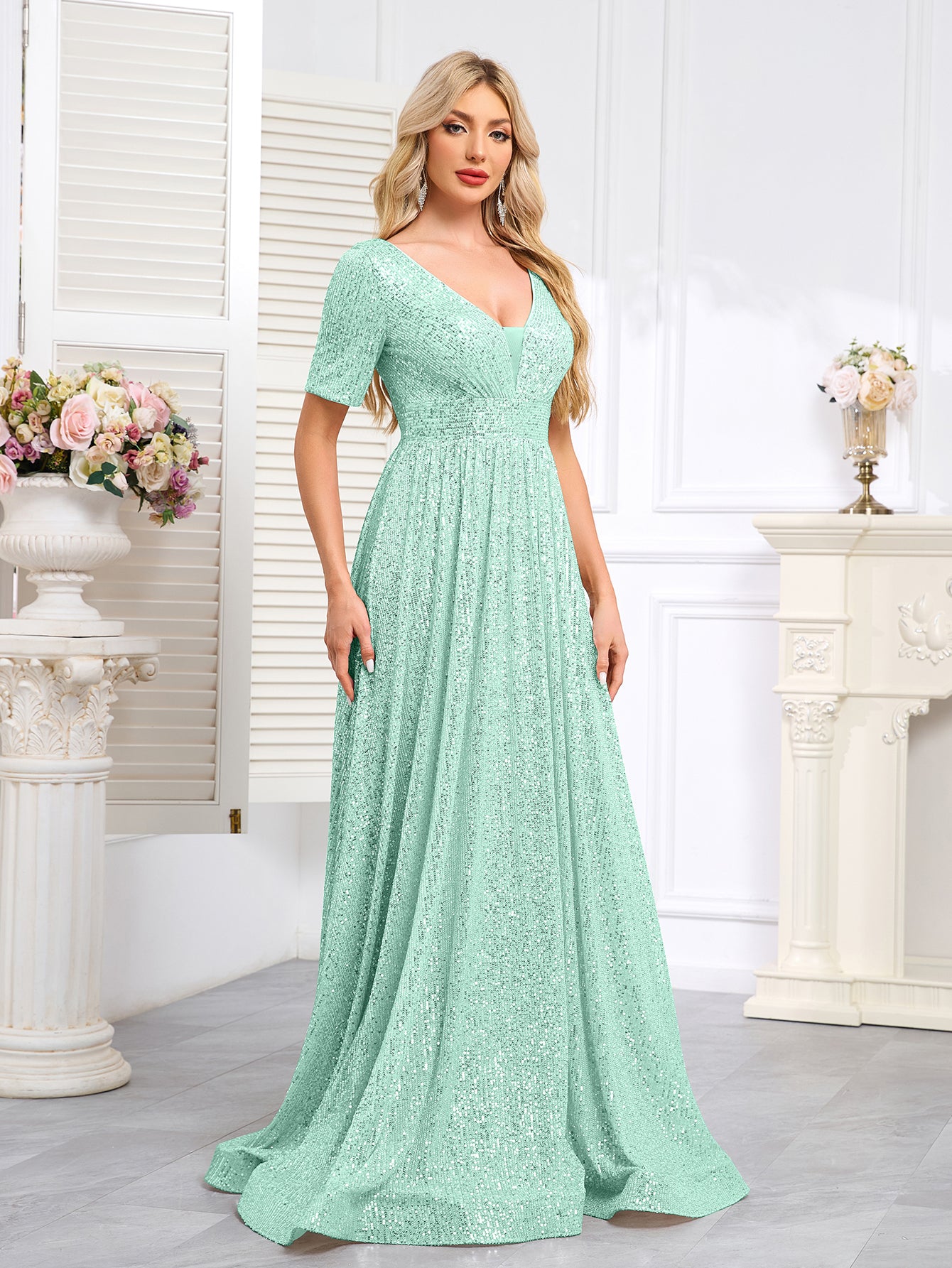 Royal Blue Sequined Short-Sleeve Gown With a Deep V-Neck and a Full, Flared Skirt.