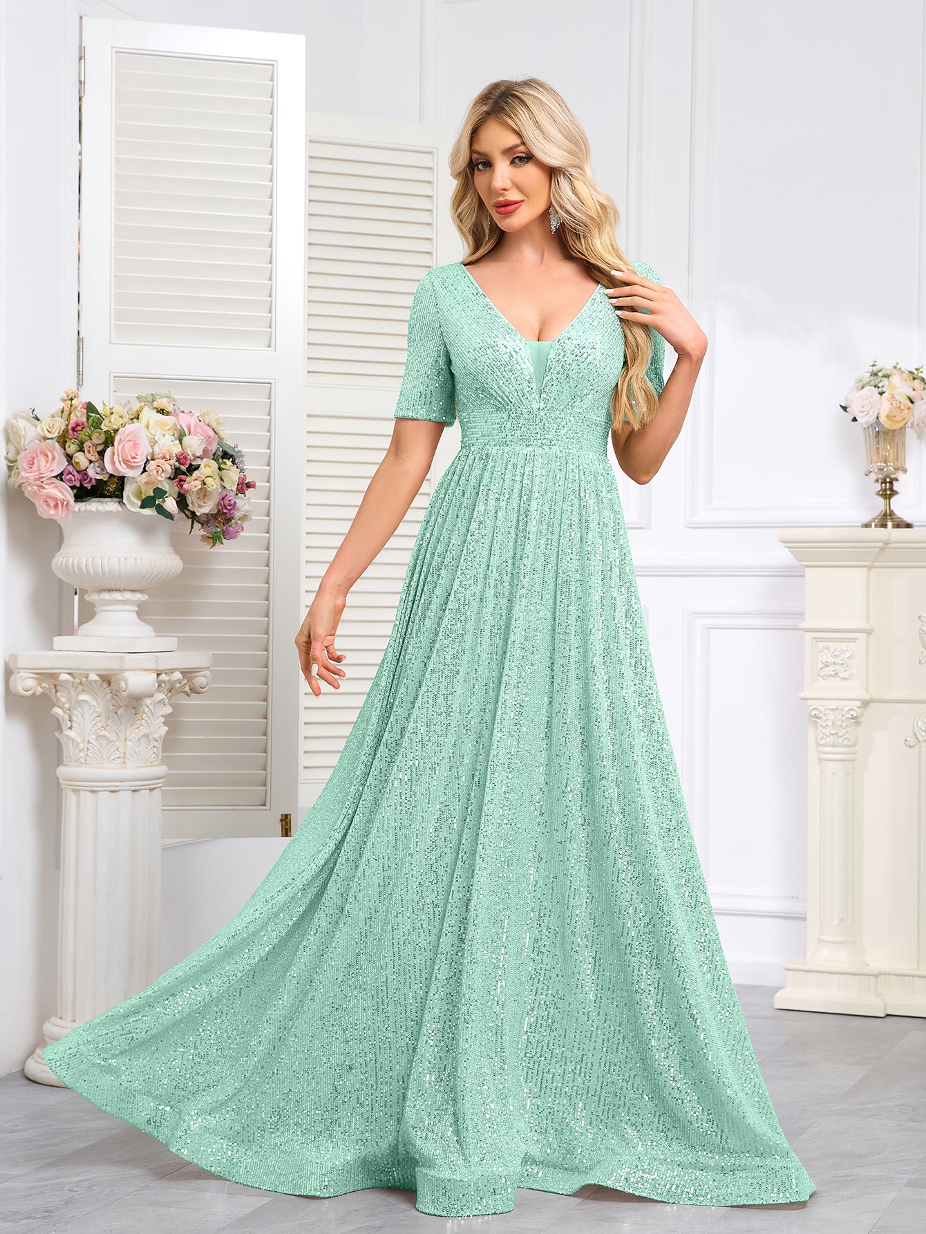 Royal Blue Sequined Short-Sleeve Gown With a Deep V-Neck and a Full, Flared Skirt.