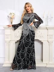 Elaborately Crafted Black And Silver Sequined Mermaid Gown With Bell Sleeves.