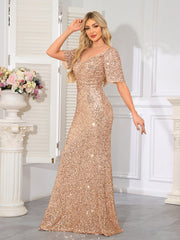 Floor-Length Evening Gown With a V-neck, Fitted Silhouette, and Hip-Hugging Design.