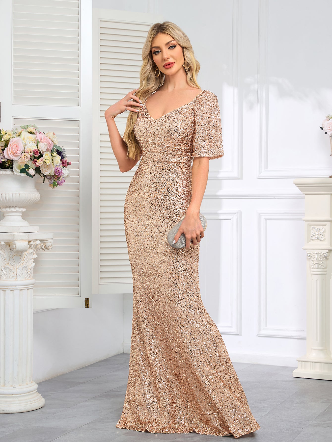 Floor-Length Evening Gown With a V-neck, Fitted Silhouette, and Hip-Hugging Design.