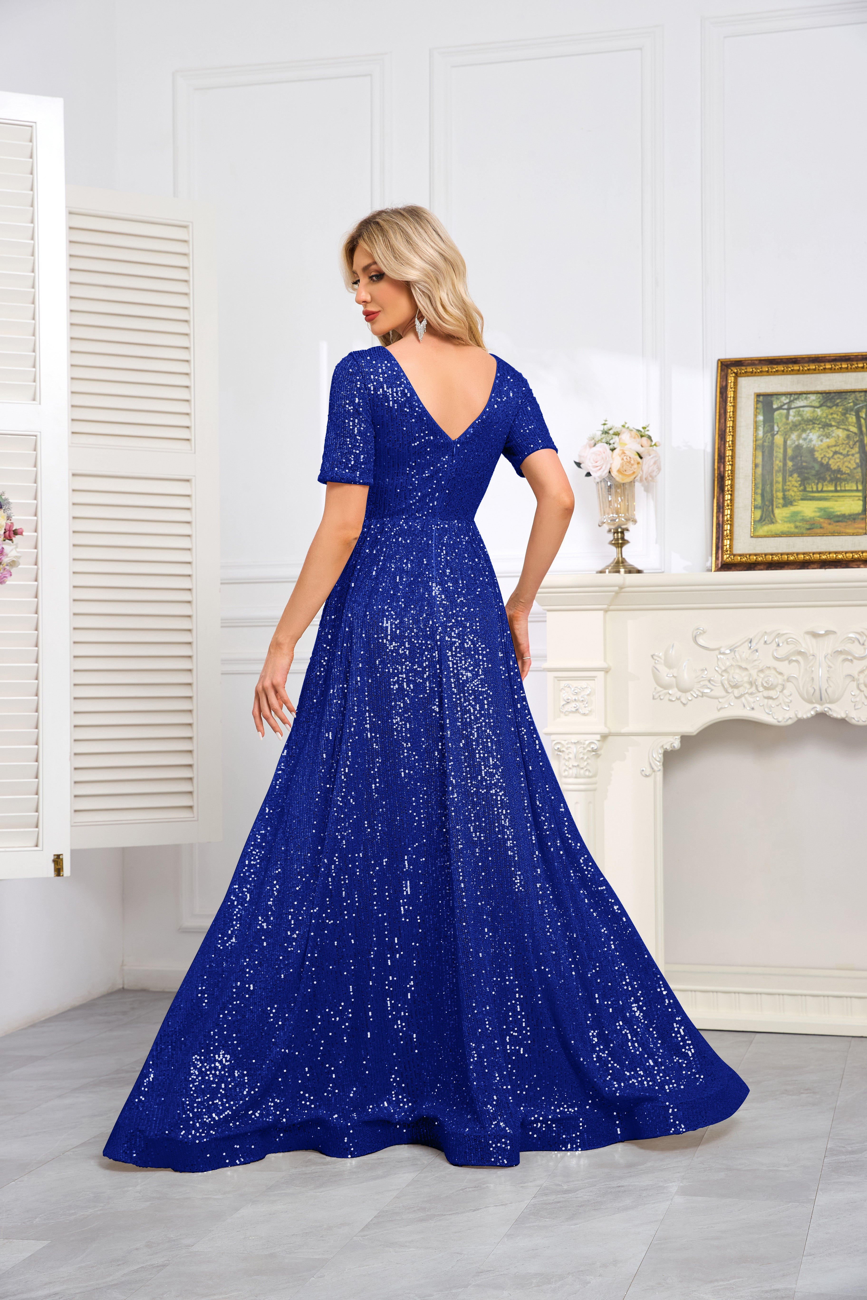 Royal Blue Sequined Short-Sleeve Gown With a Deep V-Neck and a Full, Flared Skirt.
