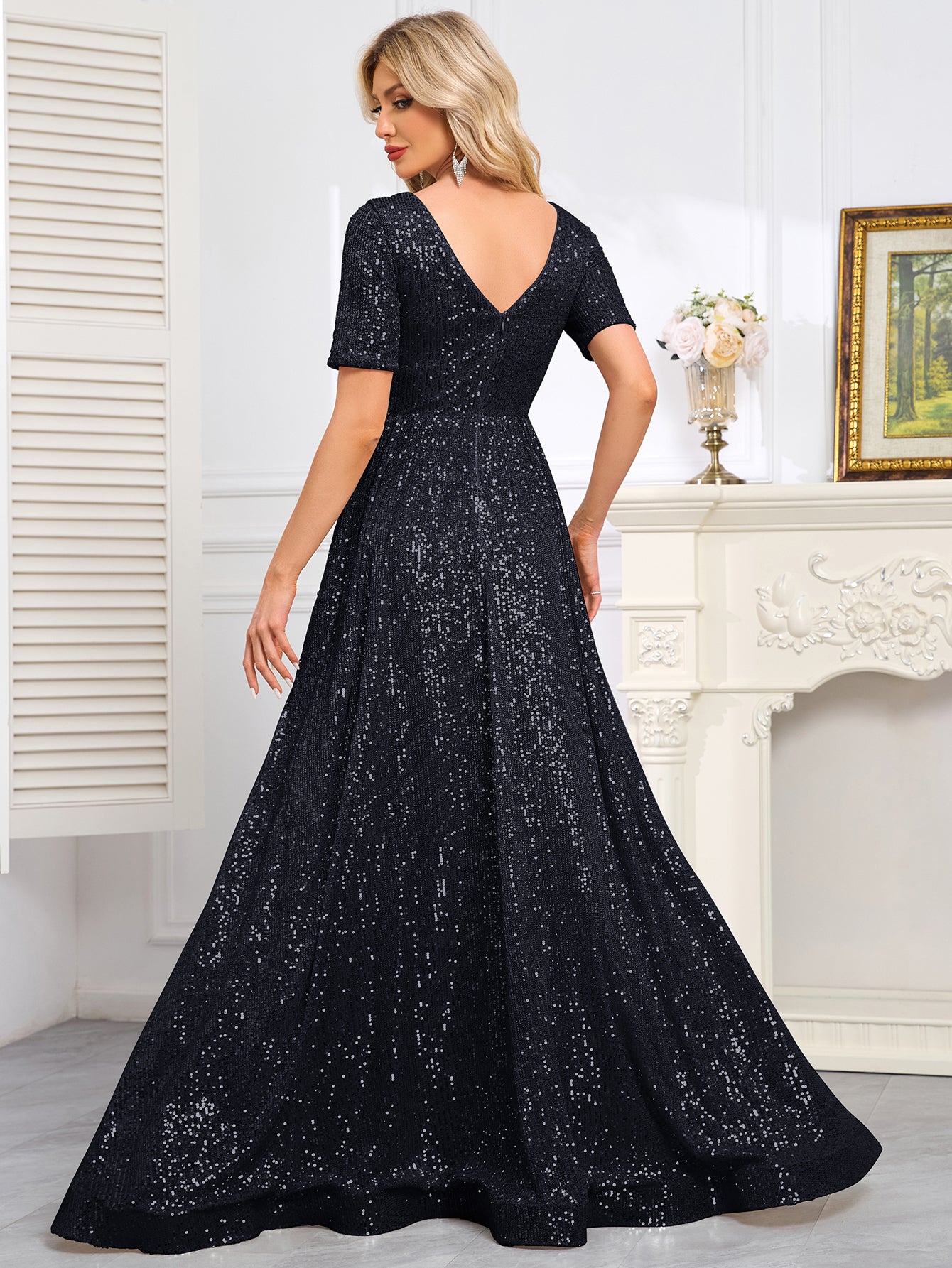 Royal Blue Sequined Short-Sleeve Gown With a Deep V-Neck and a Full, Flared Skirt.