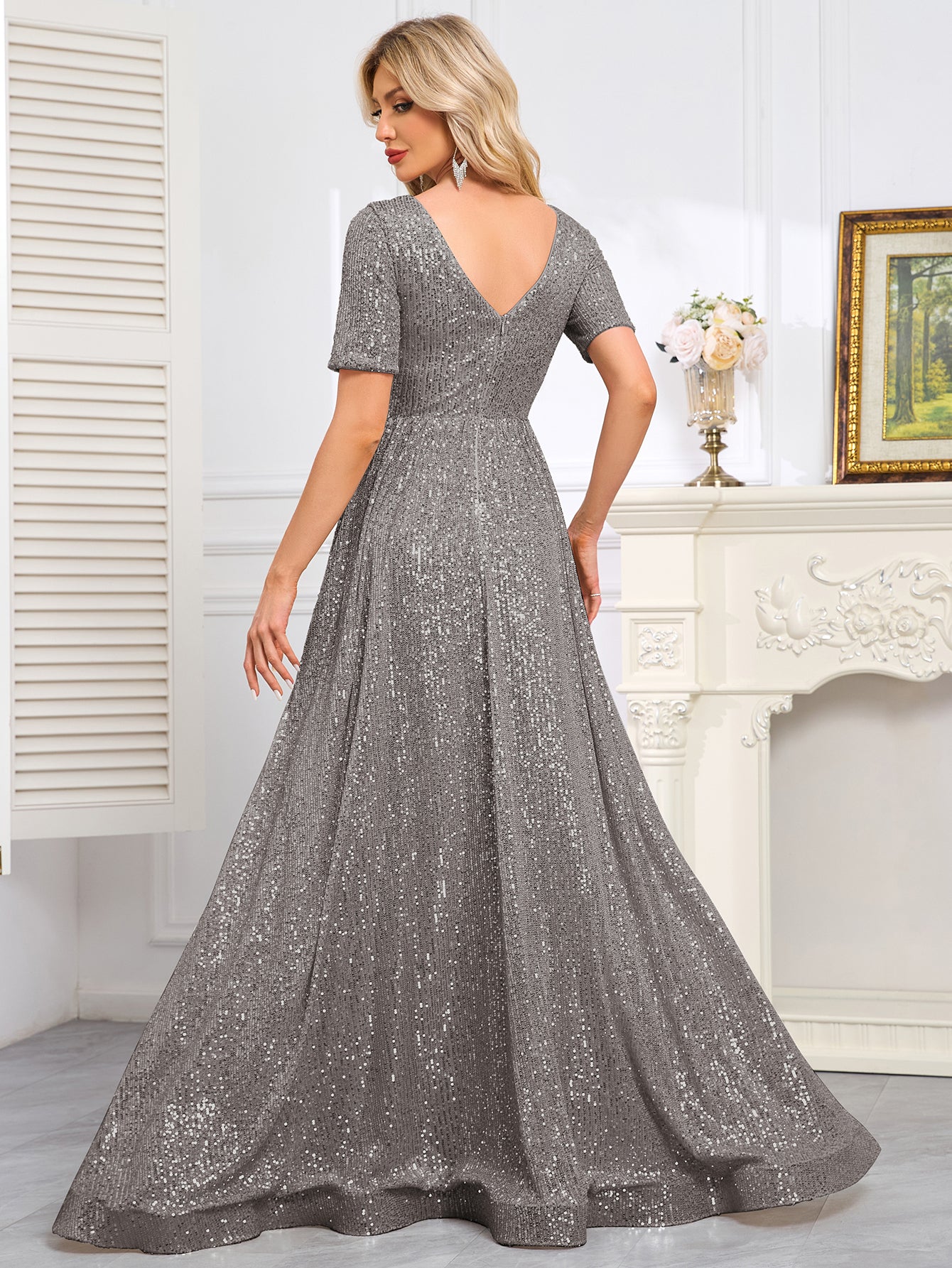 Royal Blue Sequined Short-Sleeve Gown With a Deep V-Neck and a Full, Flared Skirt.