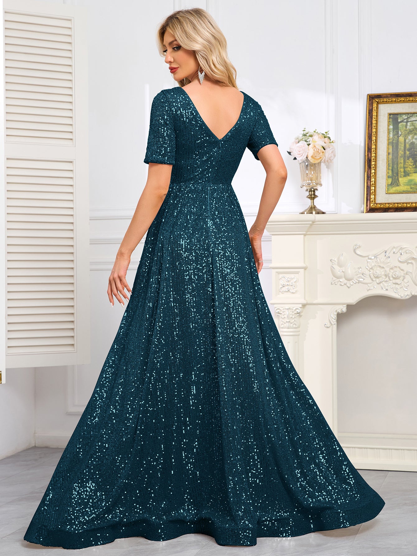 Royal Blue Sequined Short-Sleeve Gown With a Deep V-Neck and a Full, Flared Skirt.