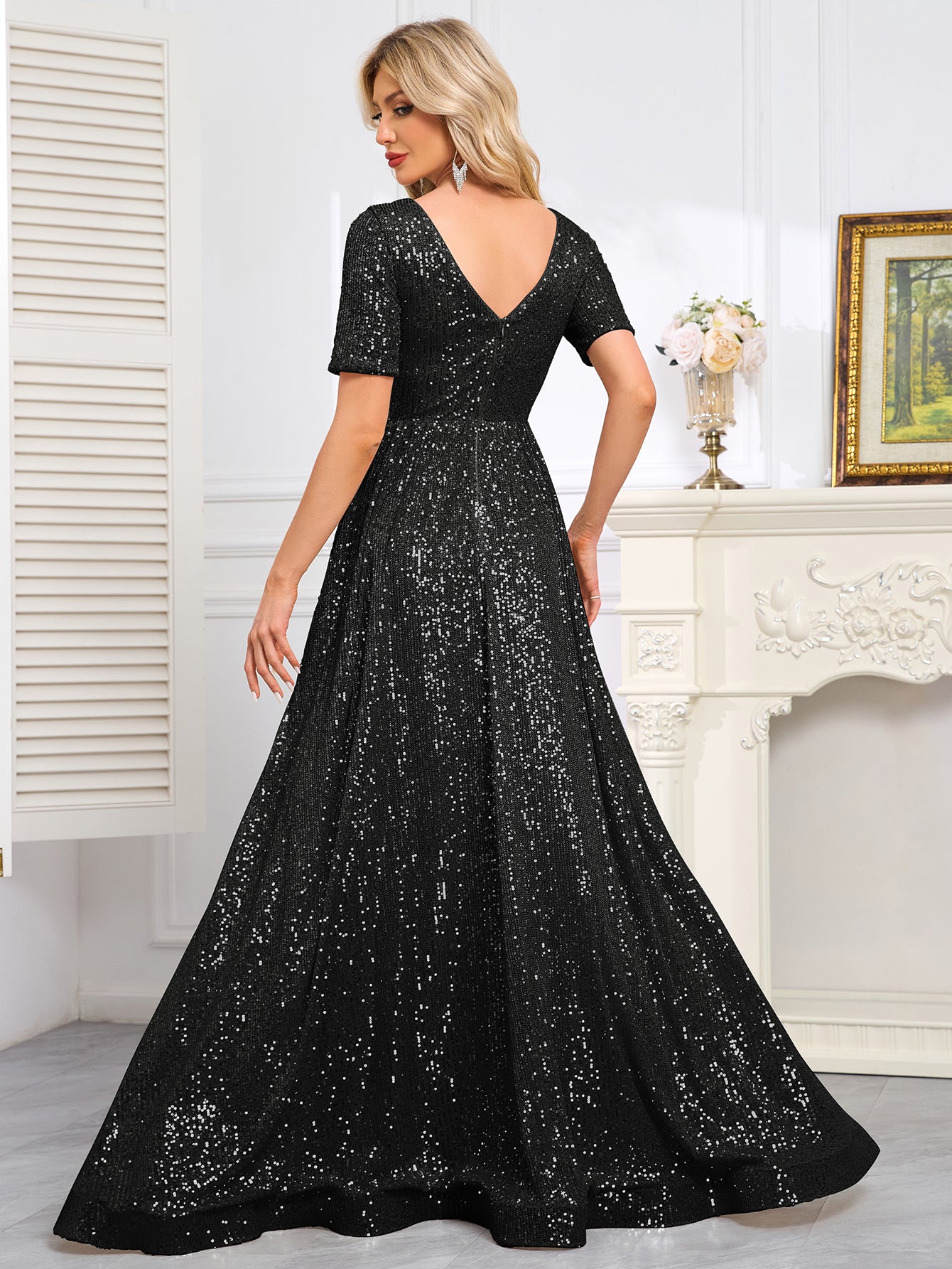 Royal Blue Sequined Short-Sleeve Gown With a Deep V-Neck and a Full, Flared Skirt.
