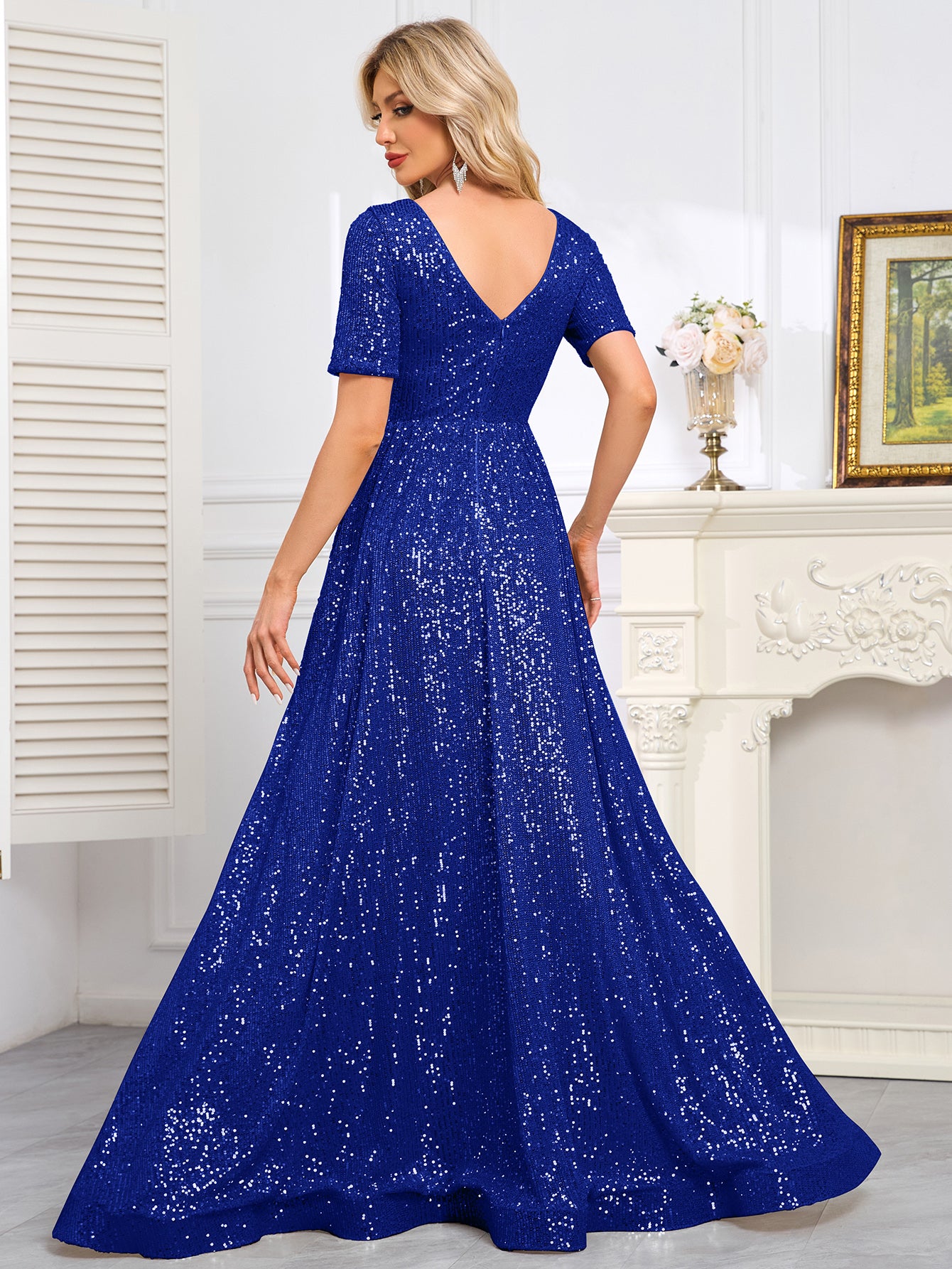 Royal Blue Sequined Short-Sleeve Gown With a Deep V-Neck and a Full, Flared Skirt.