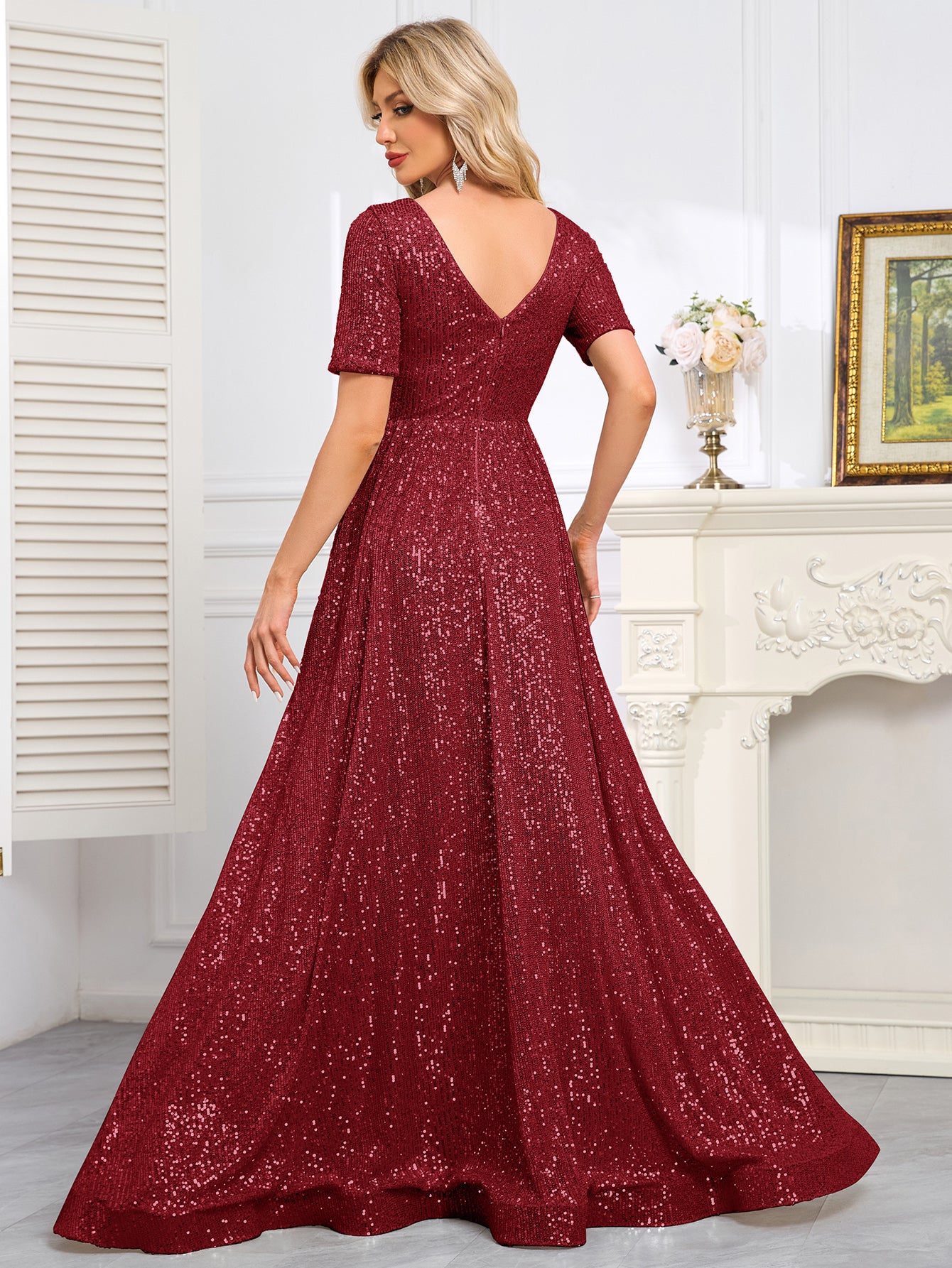 Royal Blue Sequined Short-Sleeve Gown With a Deep V-Neck and a Full, Flared Skirt.