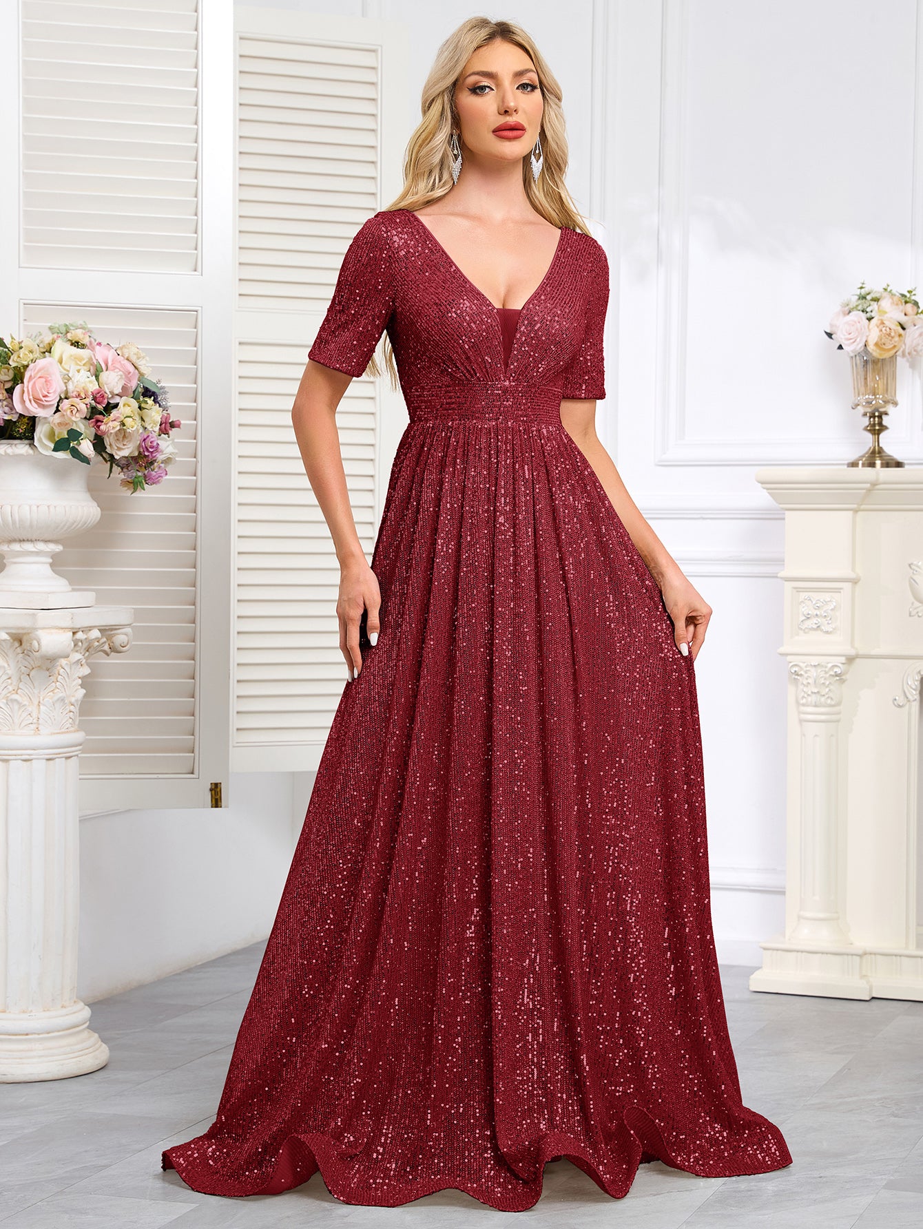 Royal Blue Sequined Short-Sleeve Gown With a Deep V-Neck and a Full, Flared Skirt.