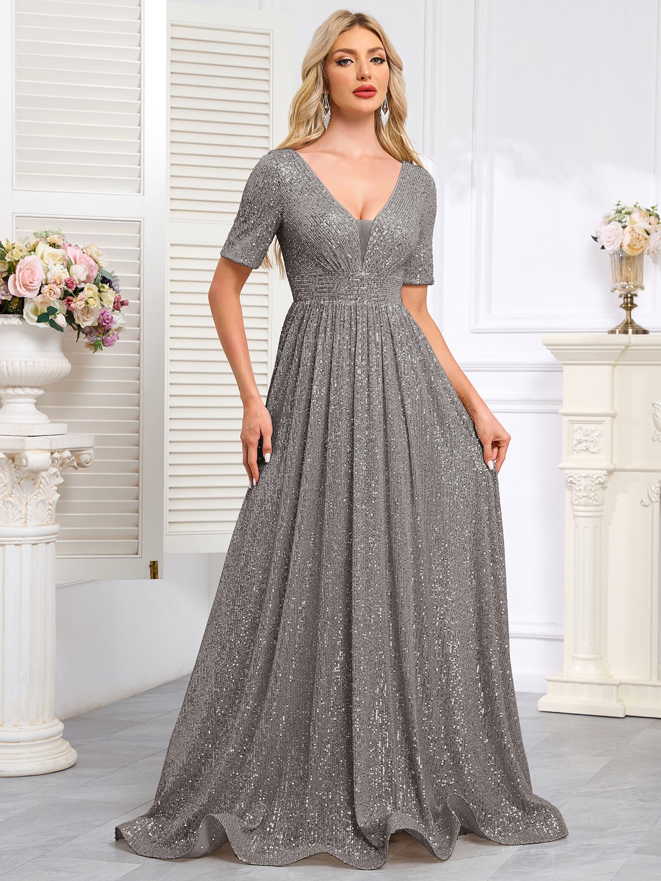 Royal Blue Sequined Short-Sleeve Gown With a Deep V-Neck and a Full, Flared Skirt.