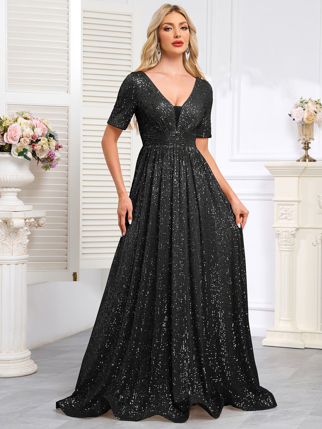Royal Blue Sequined Short-Sleeve Gown With a Deep V-Neck and a Full, Flared Skirt.