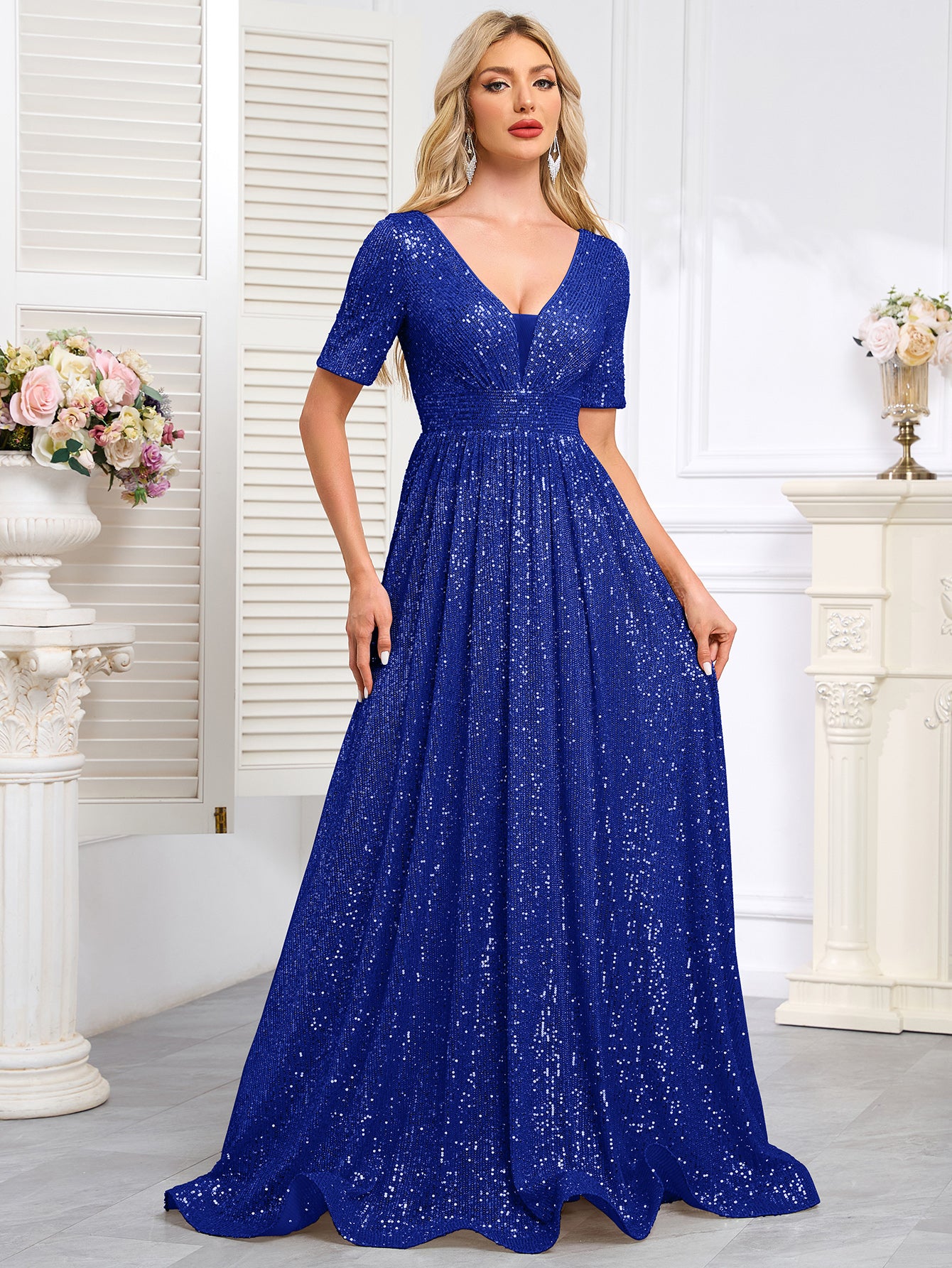 Royal Blue Sequined Short-Sleeve Gown With a Deep V-Neck and a Full, Flared Skirt.