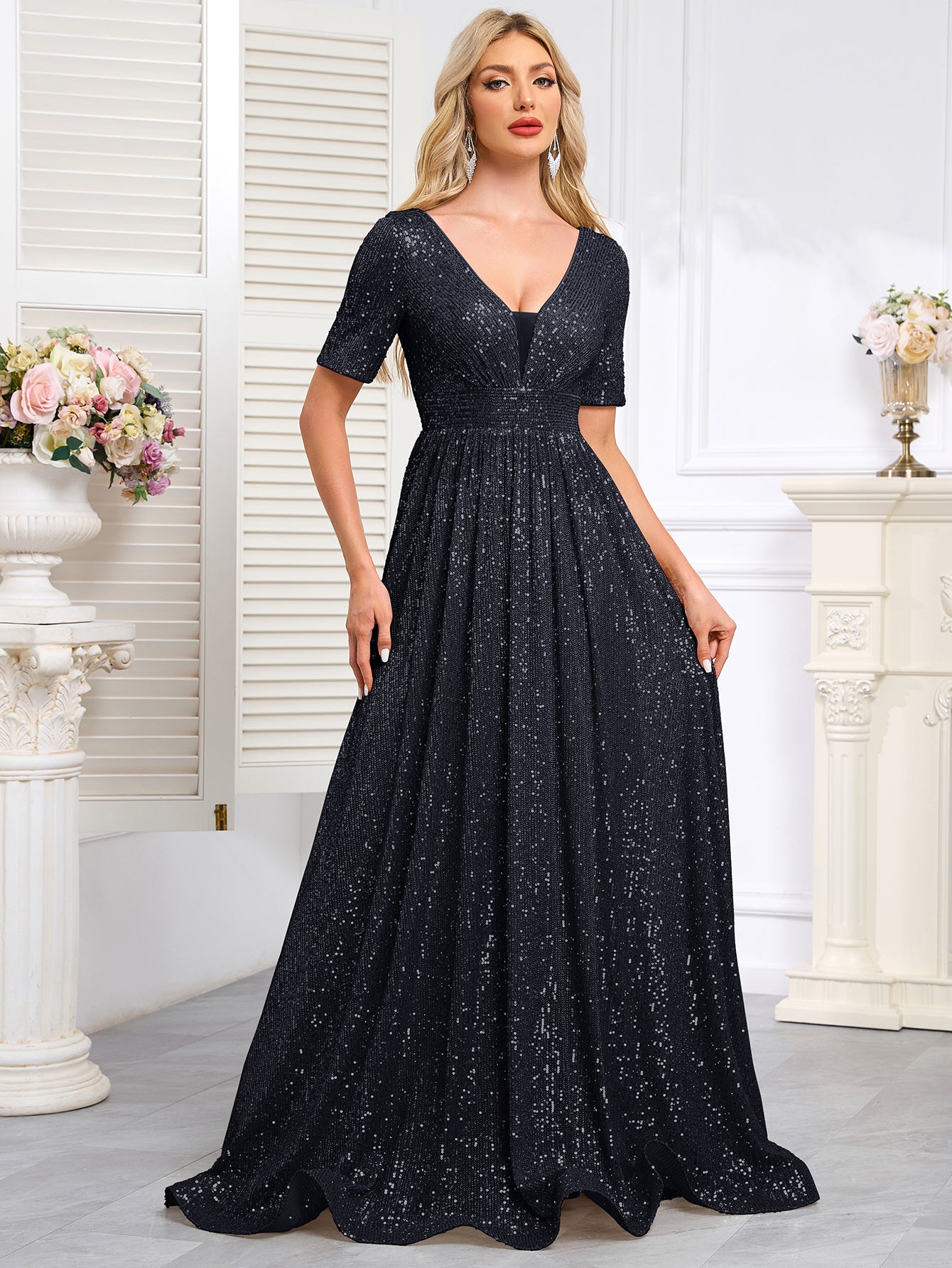 Royal Blue Sequined Short-Sleeve Gown With a Deep V-Neck and a Full, Flared Skirt.