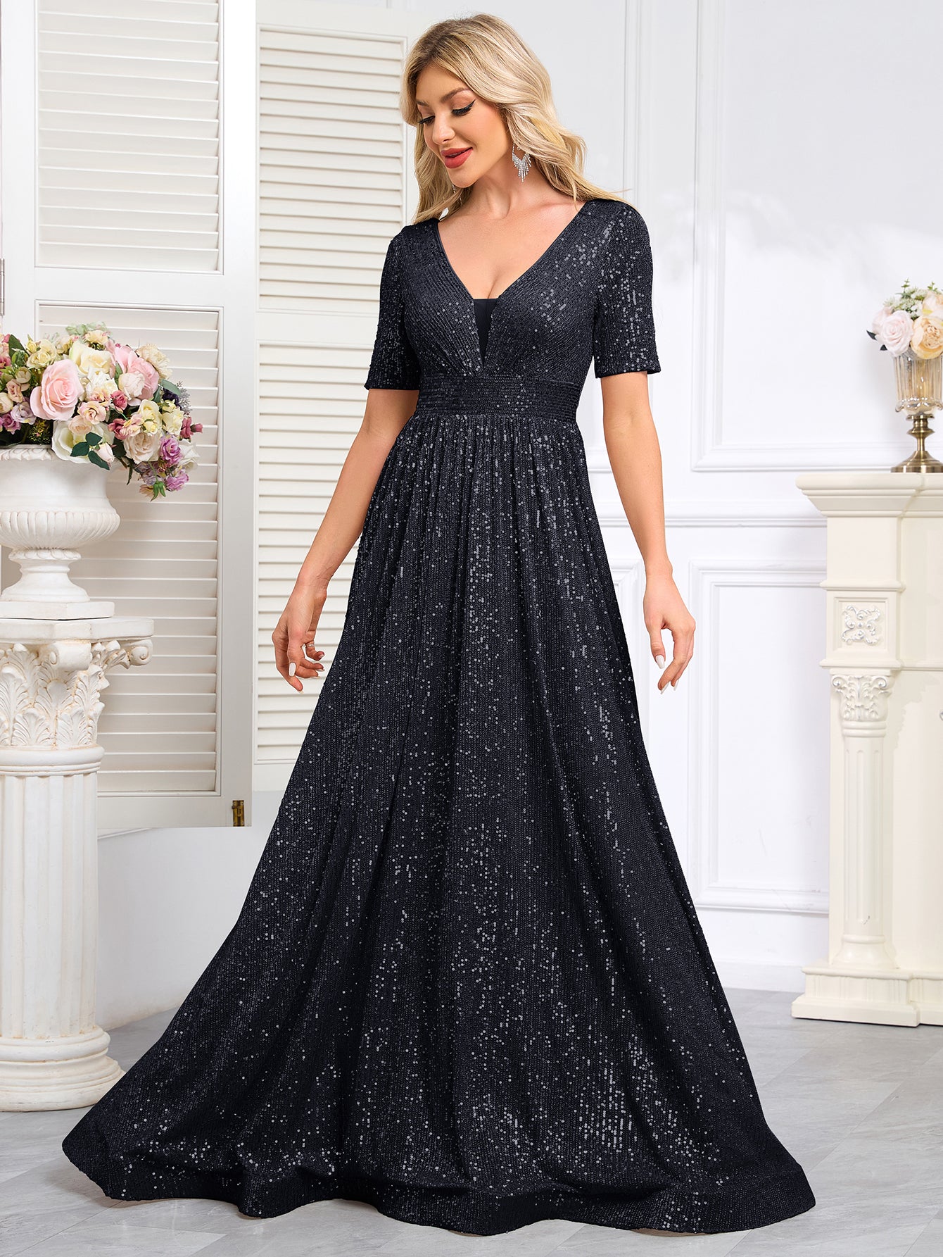 Royal Blue Sequined Short-Sleeve Gown With a Deep V-Neck and a Full, Flared Skirt.