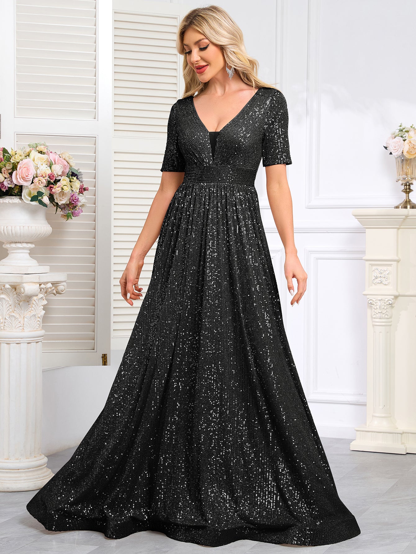 Royal Blue Sequined Short-Sleeve Gown With a Deep V-Neck and a Full, Flared Skirt.