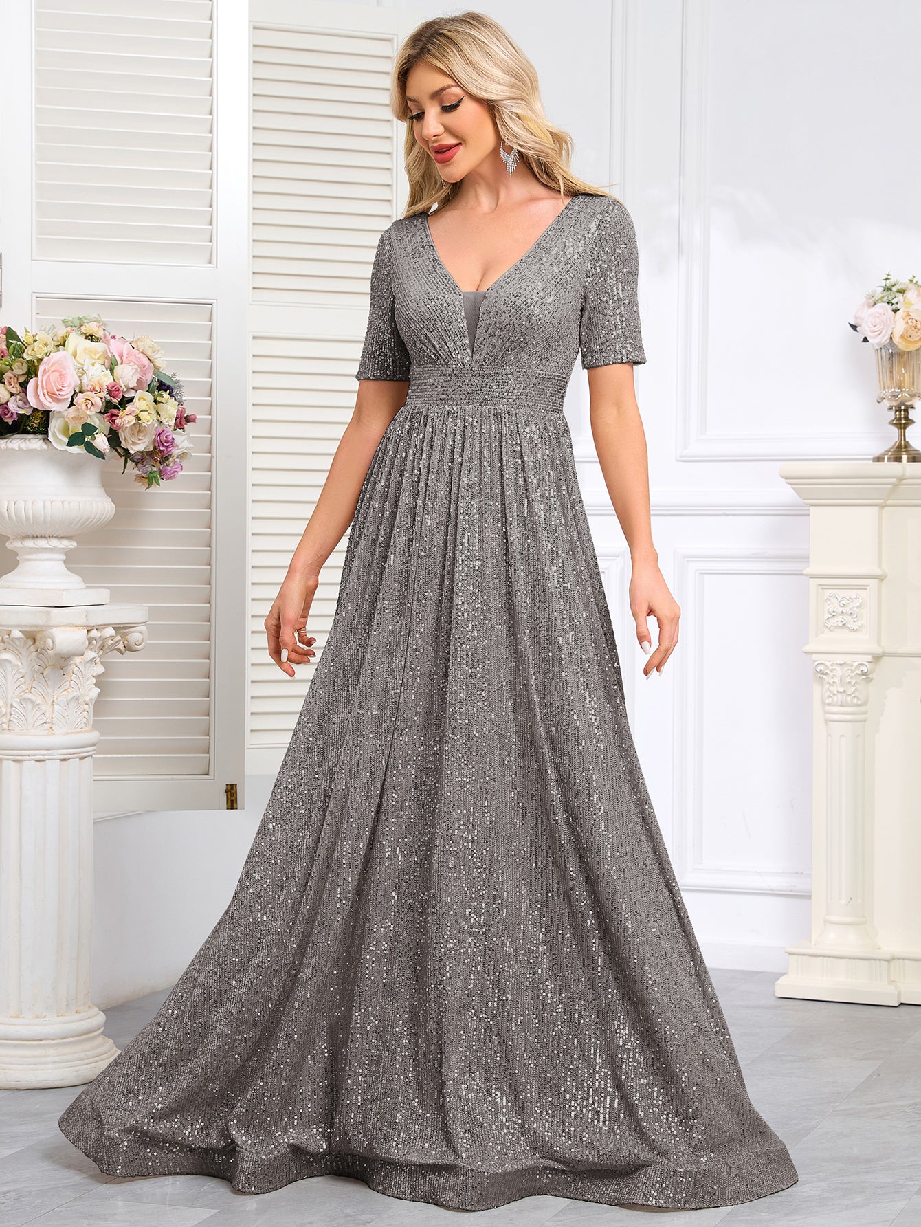 Royal Blue Sequined Short-Sleeve Gown With a Deep V-Neck and a Full, Flared Skirt.