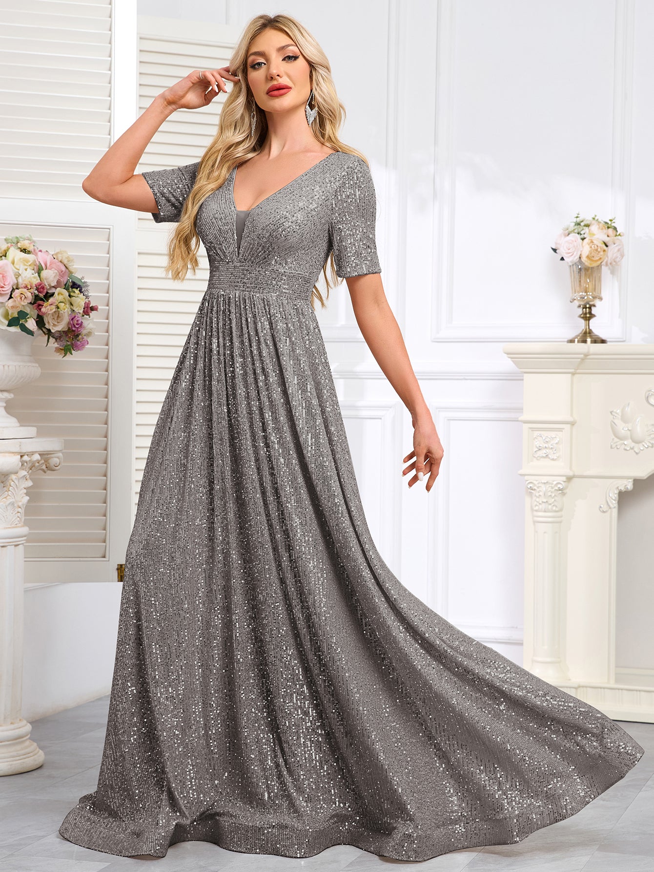 Royal Blue Sequined Short-Sleeve Gown With a Deep V-Neck and a Full, Flared Skirt.