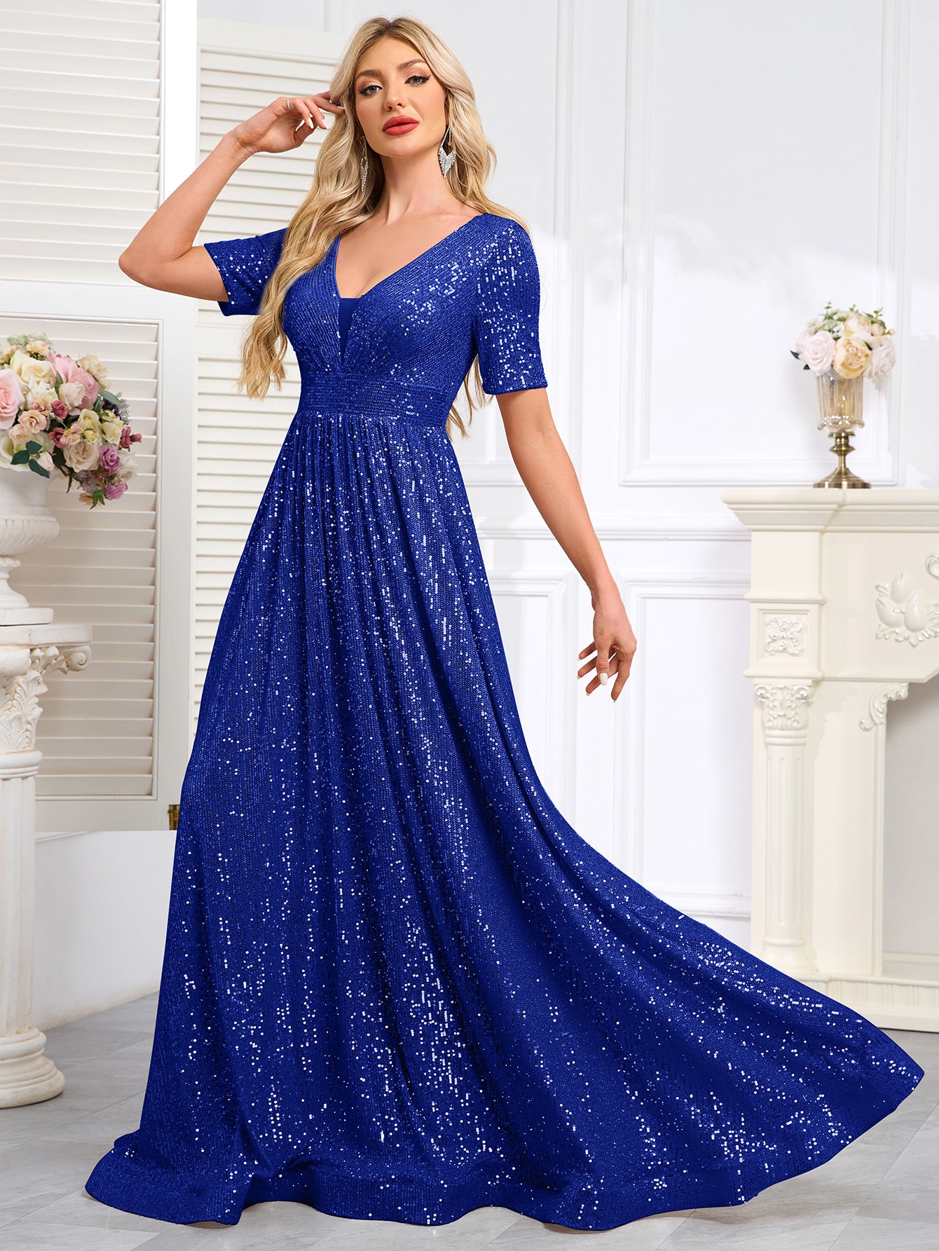 Royal Blue Sequined Short-Sleeve Gown With a Deep V-Neck and a Full, Flared Skirt.