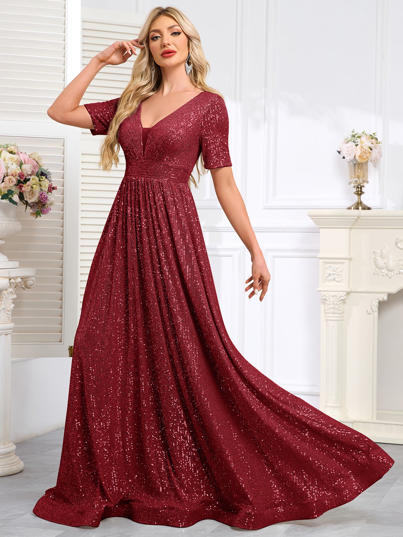 Royal Blue Sequined Short-Sleeve Gown With a Deep V-Neck and a Full, Flared Skirt.
