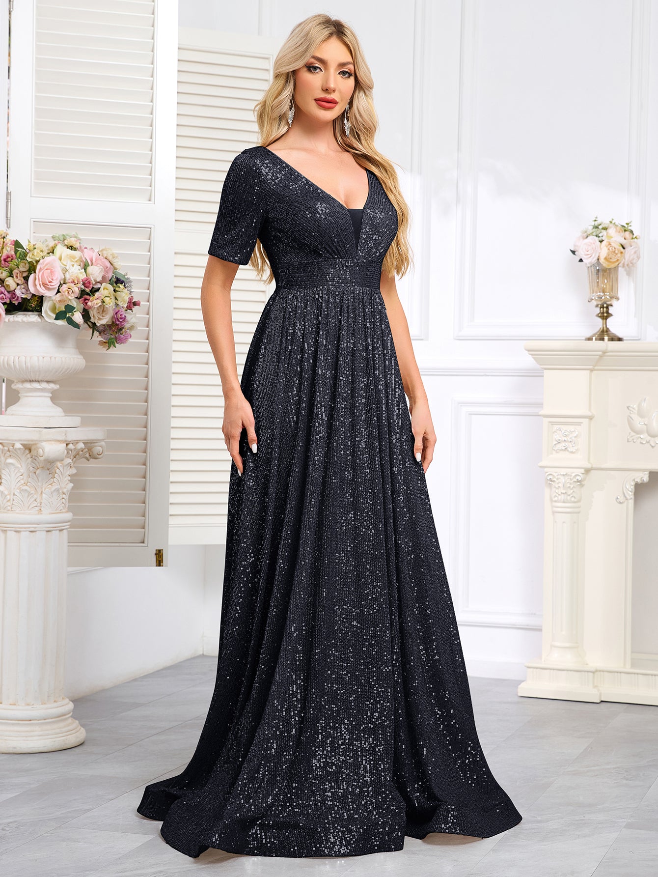 Royal Blue Sequined Short-Sleeve Gown With a Deep V-Neck and a Full, Flared Skirt.