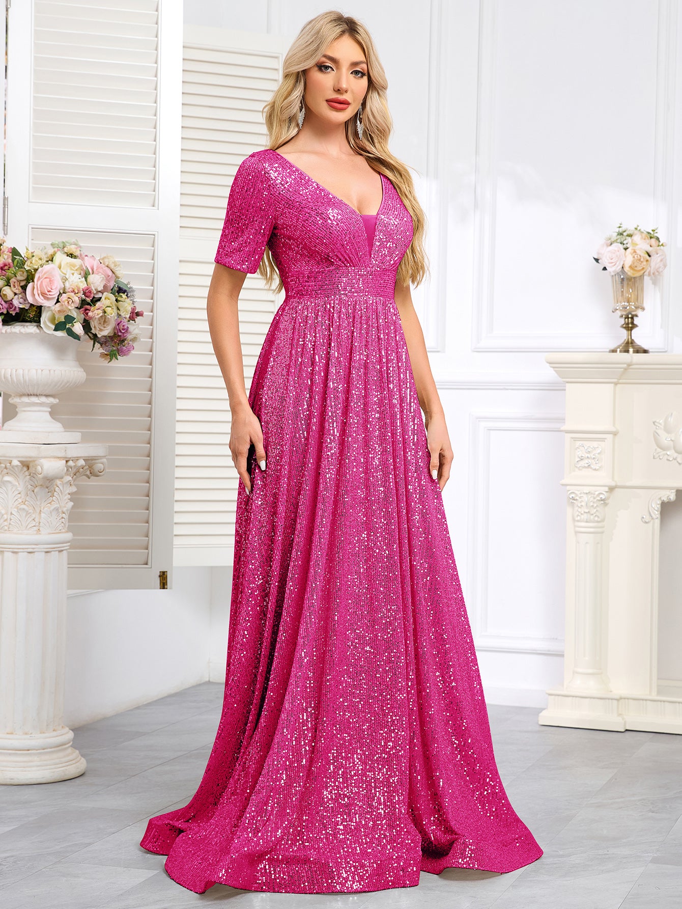 Royal Blue Sequined Short-Sleeve Gown With a Deep V-Neck and a Full, Flared Skirt.