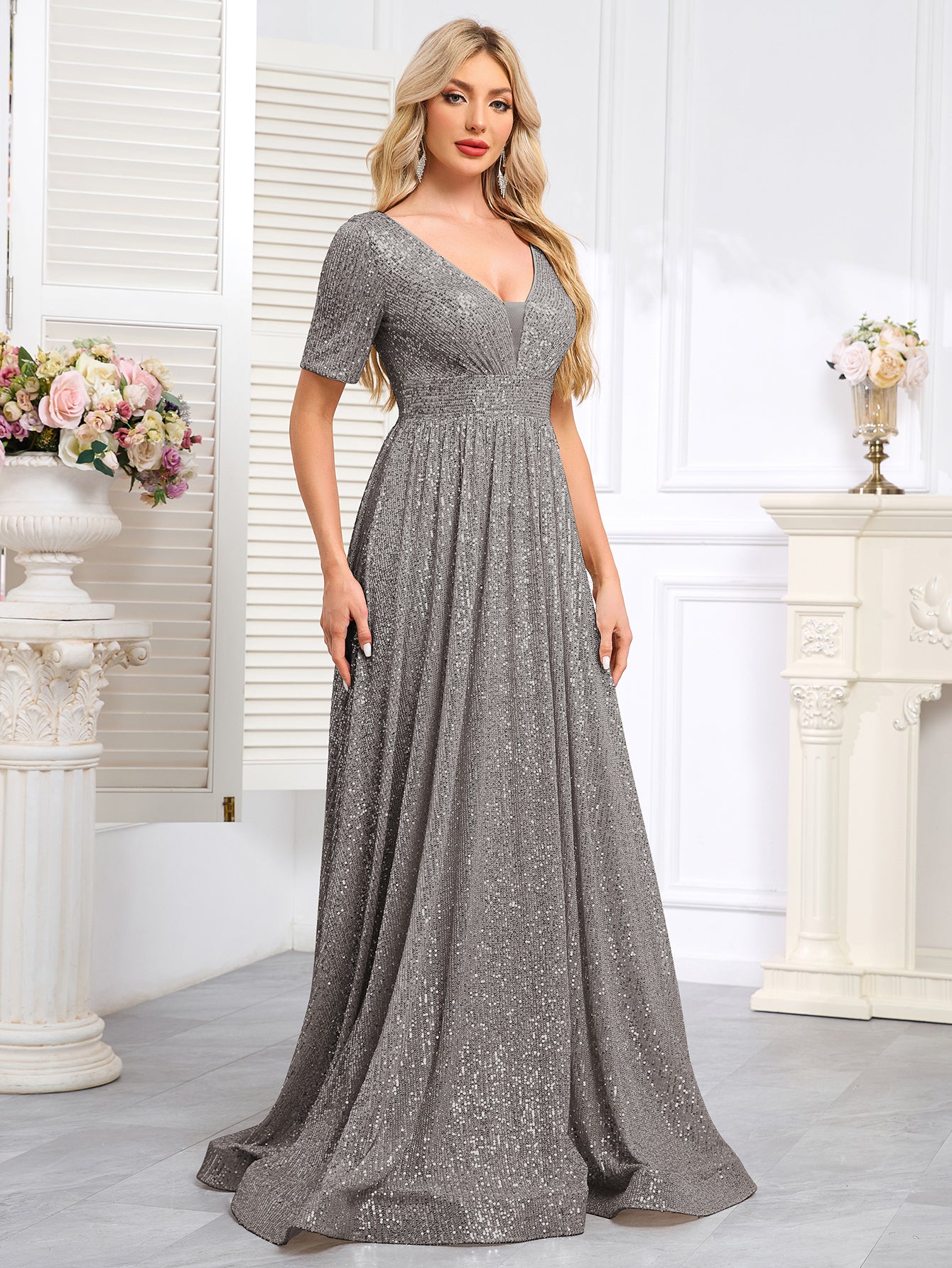 Royal Blue Sequined Short-Sleeve Gown With a Deep V-Neck and a Full, Flared Skirt.