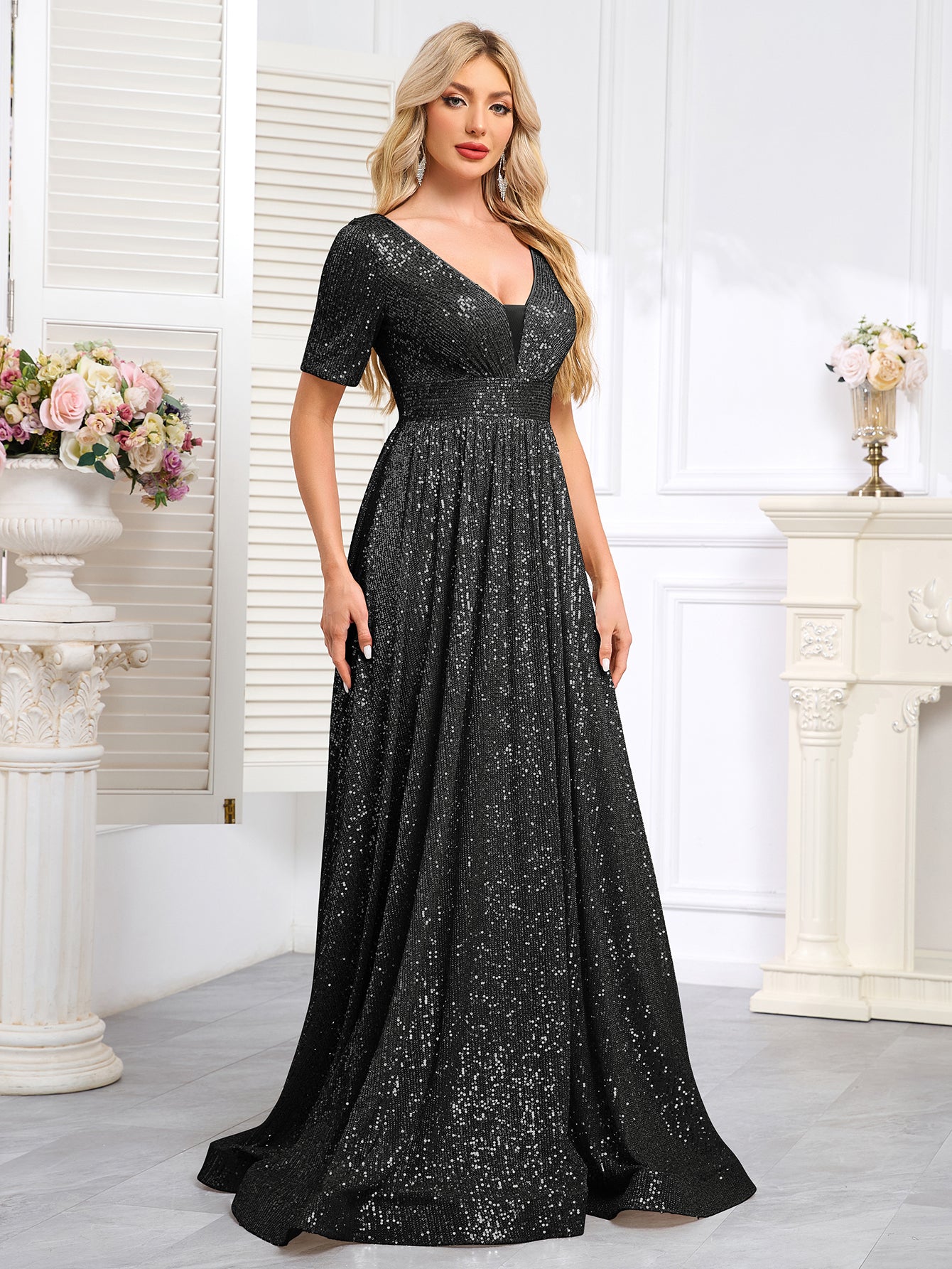 Royal Blue Sequined Short-Sleeve Gown With a Deep V-Neck and a Full, Flared Skirt.