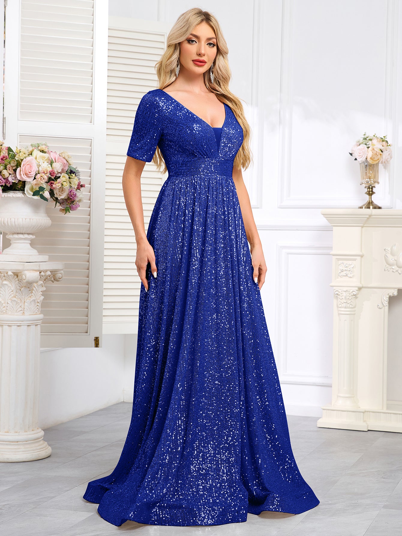 Royal Blue Sequined Short-Sleeve Gown With a Deep V-Neck and a Full, Flared Skirt.