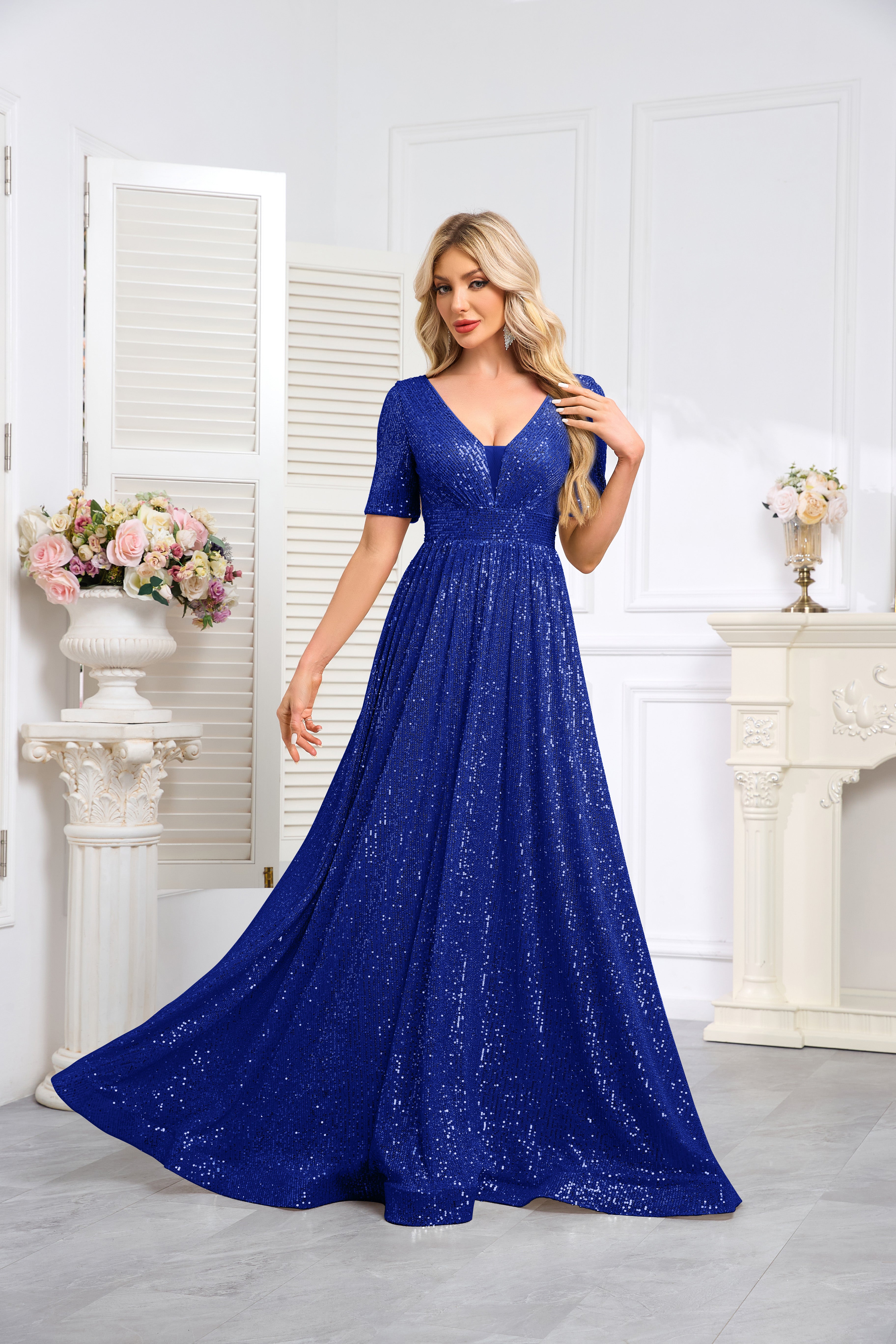 Royal Blue Sequined Short-Sleeve Gown With a Deep V-Neck and a Full, Flared Skirt.