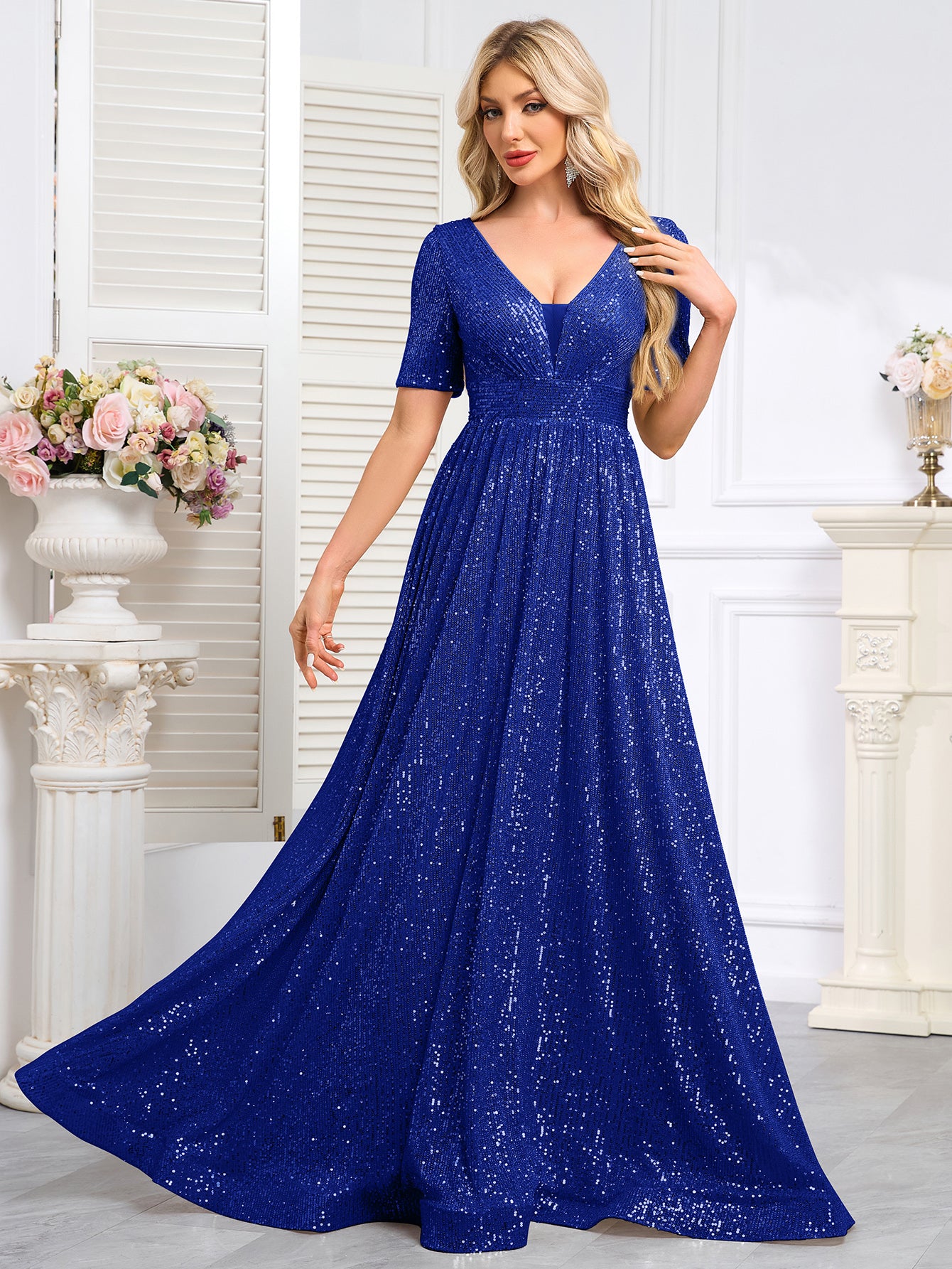 Royal Blue Sequined Short-Sleeve Gown With a Deep V-Neck and a Full, Flared Skirt.