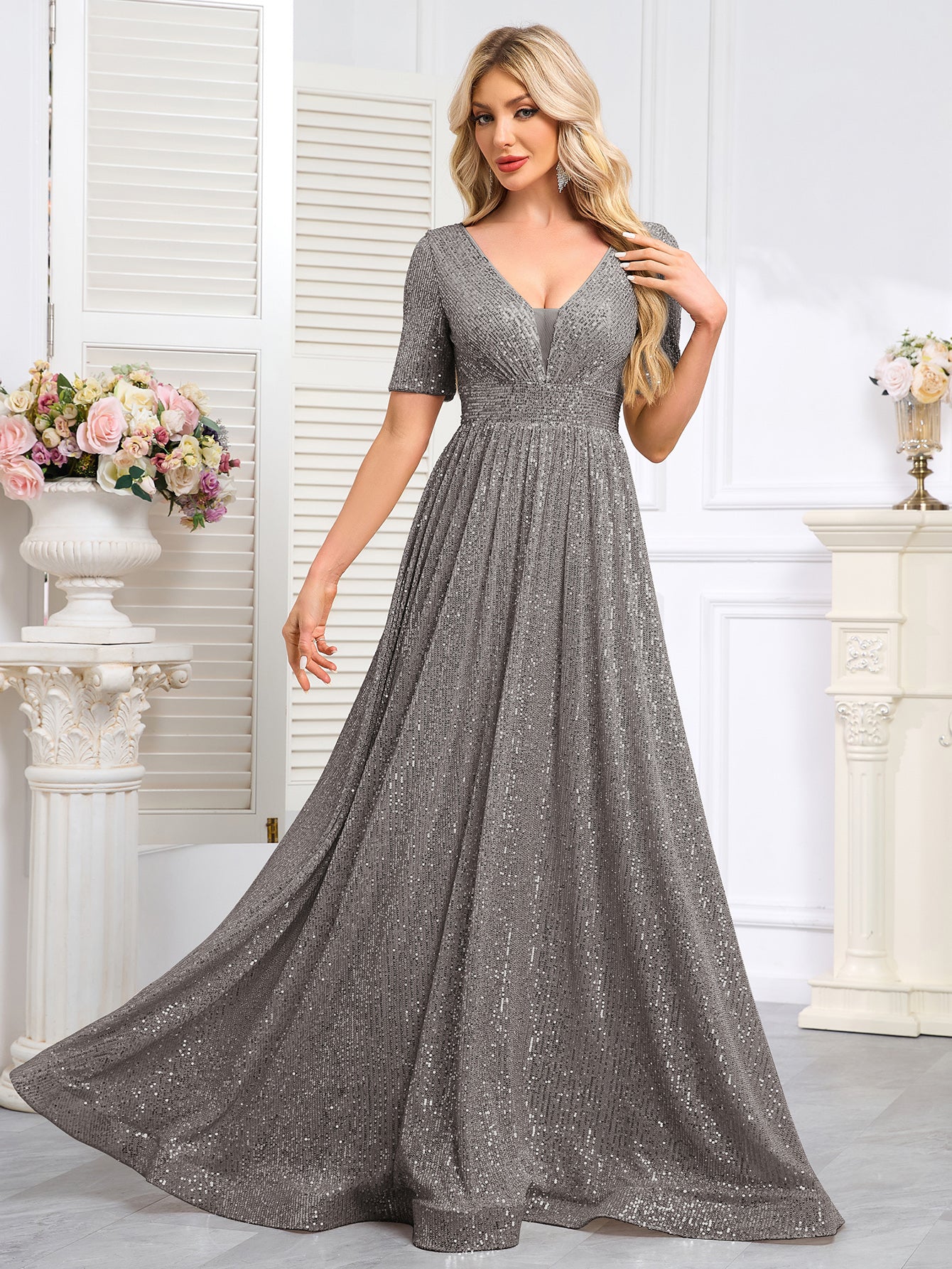 Royal Blue Sequined Short-Sleeve Gown With a Deep V-Neck and a Full, Flared Skirt.