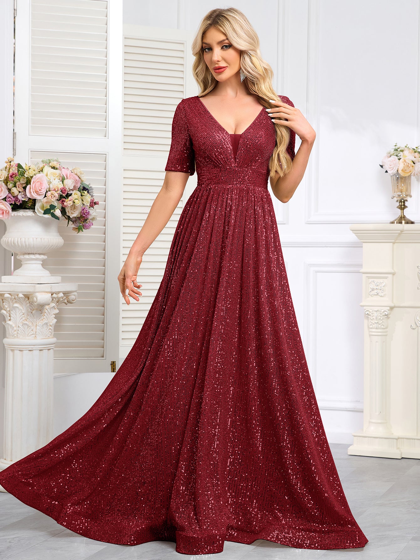 Royal Blue Sequined Short-Sleeve Gown With a Deep V-Neck and a Full, Flared Skirt.