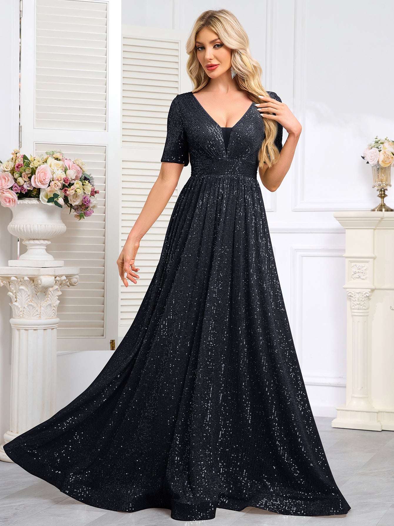 Royal Blue Sequined Short-Sleeve Gown With a Deep V-Neck and a Full, Flared Skirt.