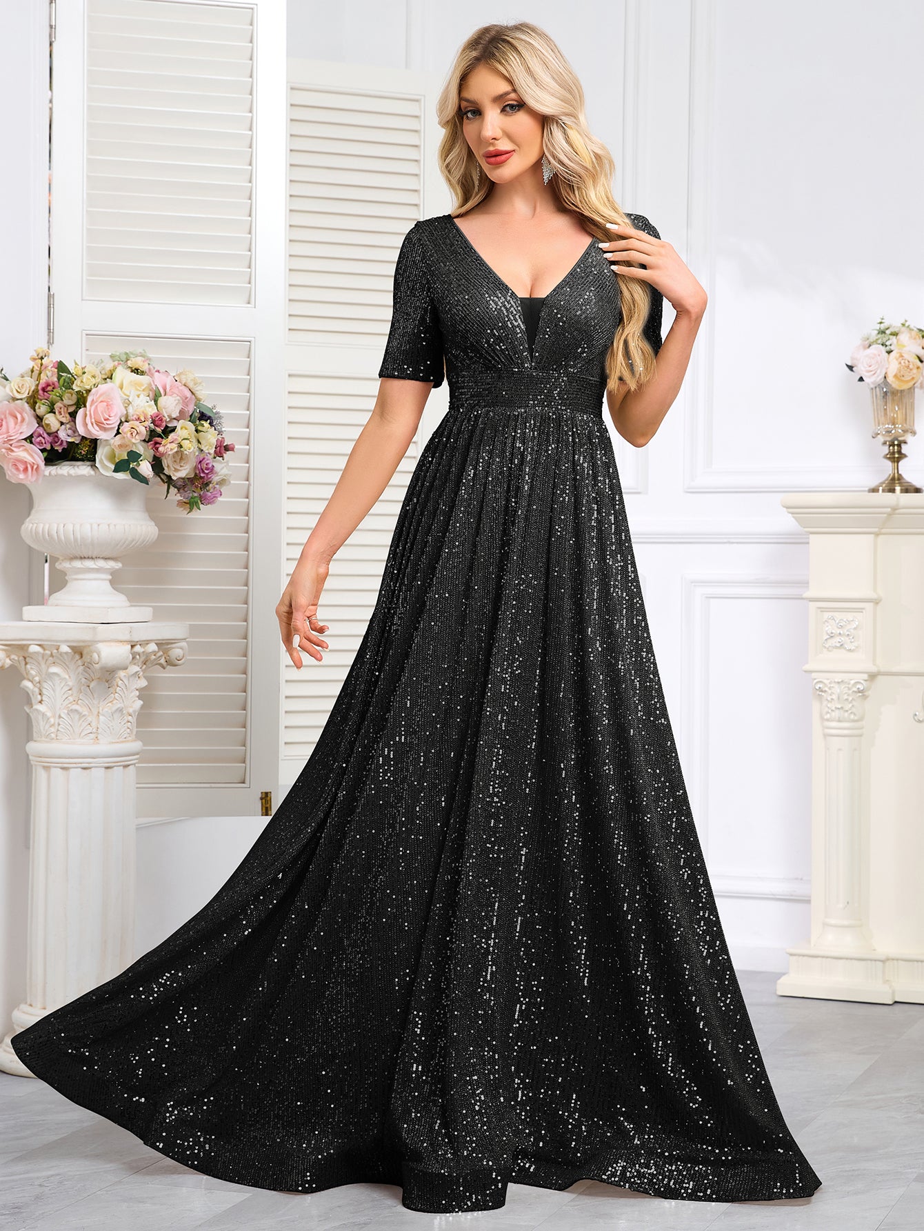 Royal Blue Sequined Short-Sleeve Gown With a Deep V-Neck and a Full, Flared Skirt.